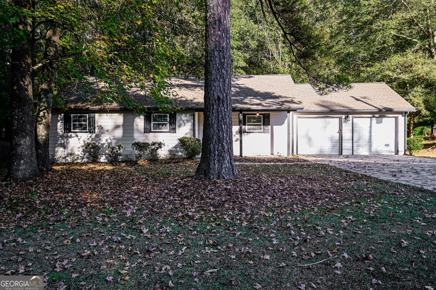 Find peace and fresh beginnings at this beautifully renovated ranch tucked in the quiet Country Woods community. Warm light fills every room, offering comfort after a long day, while the fireplace invites cozy evenings with family and friends. Outside, the spacious yard is perfect for cookouts, games, and quiet mornings under the Georgia sky. Experience the perfect blend of comfort and country charm-schedule your showing today and see why this feels like home.