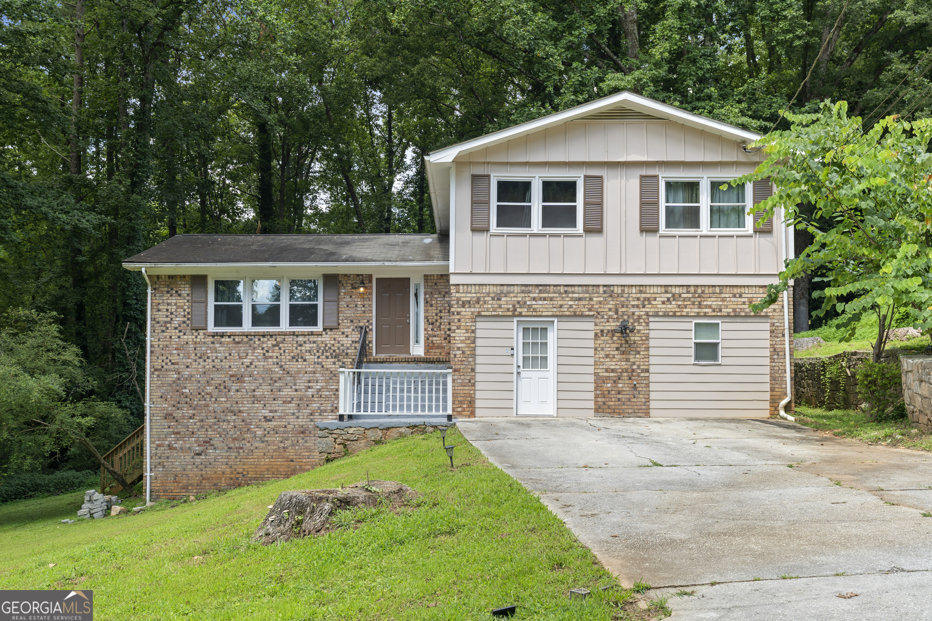 Welcome to this versatile split-level home-perfect for multi-generational living, house hacking, or investment! This spacious property features two full kitchens, offering flexibility and functionality for a variety of living arrangements. Upstairs, you'll find a bright and inviting layout with hardwood floors, a freshly updated kitchen, and comfortable dining and living areas. The lower level is a fully finished basement with its own private entry, complete with a second kitchen, bedroom, bathroom, and living space-ideal for a rental unit or extended family. Enjoy a large backyard with mature trees and a spacious patio, perfect for relaxing or entertaining. With recent updates and a layout that maximizes both privacy and potential income, this home has endless possibilities.