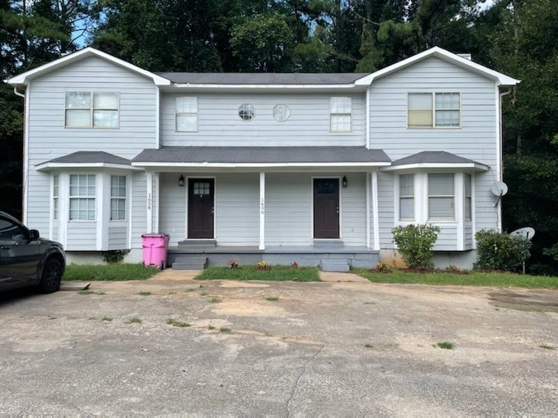 Welcome home to this 3-bedroom, 2.5-bath duplex in a prime location close to Kroger, Walmart, restaurants, and I-20 for an easy commute. The main level features a large open living and dining area, perfect for entertaining or relaxing by the fireplace. The kitchen comes fully equipped with stainless steel appliances, including refrigerator, oven/range, and dishwasher, and offers washer/dryer connections. Step out the back door to enjoy a private deck and wooded views. Upstairs, you'll find three generously sized bedrooms and two full baths. The primary suite overlooks the front of the property and includes its own private bath. Two additional bedrooms share a full bath, making it an ideal layout for families, roommates, or a home office setup. PROPERTY KNOWN AS 1606 KIRKLAND RD.