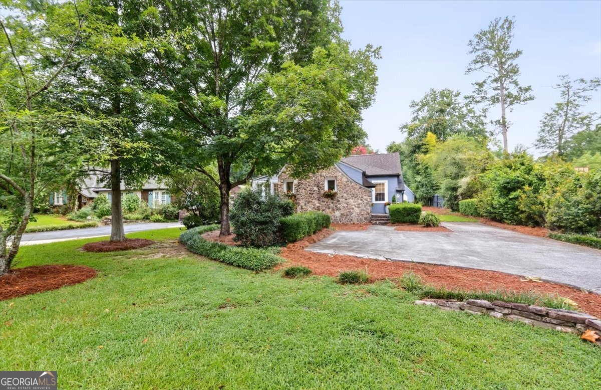 Cutest house ever - Ingleside Charmer!! Precious entrance nook. Stone fireplace, Sunroom, hardwood galore. Total redone Kitchen with butcher block counters and new bar. Den off Kitchen with 19 ft vaulted ceiling and a wall of glass looking outside to a huge back yard with stone fireplace. Master Bedroom has a new huge and fabulous Master Bathroom. This is the true Ingleside cottage!