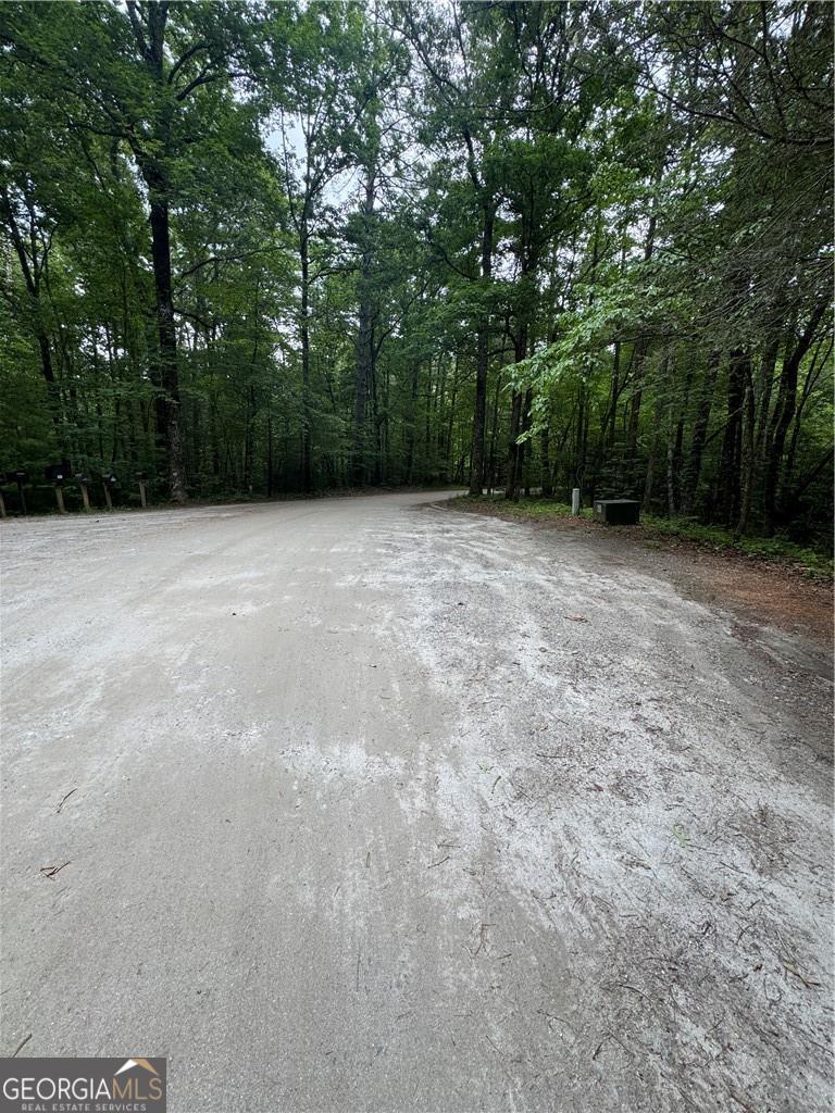 This beautiful 3.16-acre wooded property offers the perfect mountain escape, tucked away in the peaceful Nimblewill Creek community of the North Georgia Mountains. Comprised of Lot 44 and Lot 45, being sold together, this parcel backs up directly to the Chattahoochee National Forest, giving you immediate access to hiking trails, fishing spots, and the endless natural beauty that defines the region. Set within a quiet and charming neighborhood, the property offers the ideal setting for those seeking to unwind and enjoy the serenity of nature. The gently rolling terrain is covered with mature hardwoods and native plants, offering a tranquil environment that is perfect for building a cozy weekend retreat or a custom, full-time home. With deed restrictions in place to preserve the community's character, you'll enjoy the benefits of a well-maintained neighborhood while still feeling completely immersed in nature. Whether you're planning to build now or hold for the future, this rare offering delivers a unique opportunity to own land in one of North Georgia's most serene and scenic areas. Don't miss your chance to create lasting memories on this one-of-a-kind property, where forest views, quiet surroundings, and mountain charm await.