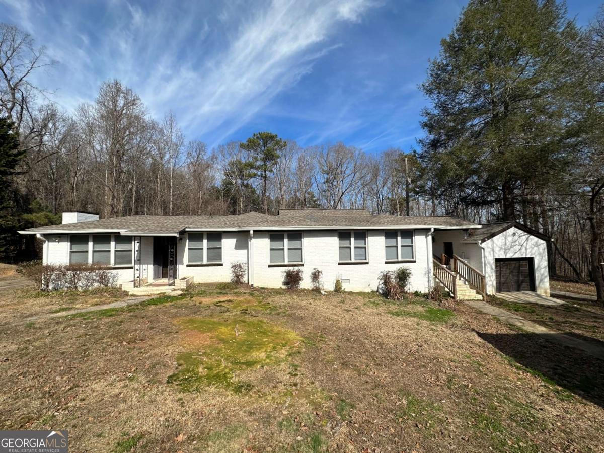 Major Privacy!!!! Beautiful renovated ranch 4 bed 2 bath home on 1 acre Private lot. This home features a full wrap around driveway and a private entry, where nothing else can be built for acres. Space and Privacy is hard to come by and this lot has ample room for multiple uses. This home features new flooring and State of the art Kitchen with Granite Countertops, Soft Close Cabinets and Stainless steel appliances. Enjoy time out on the huge deck overlooking your private lot. This home qualifies for a $7500 grant from lender, along with incentives from the seller.
