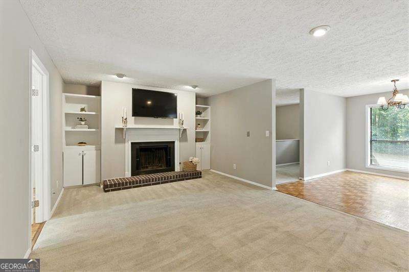 Welcome to this spacious top-floor 3-bedroom, 2-bath condo in the sought-after Cedar Circle community of Tucker, GA. This light-filled home features an open floor plan with a cozy fireplace framed by built-in shelving, perfect for relaxing or entertaining. The flex 3rd bedroom offers endless possibilities-use it as a sunroom, sitting area, oversized home office, or guest bedroom. A bonus landing at the top of the stairs provides an additional office or study space. The large private deck overlooks a peaceful, tree-lined backyard, making it the ideal spot for outdoor dining or morning coffee. Enjoy all the amenities of this swim/tennis community, while being just minutes from historic Downtown Tucker, known for its charming shops, local dining, and vibrant community events. With convenient access to I-85 and I-285, commuting and daily errands are a breeze. Don't miss your chance to own this beautiful condo in a prime Tucker location-schedule your tour today!
