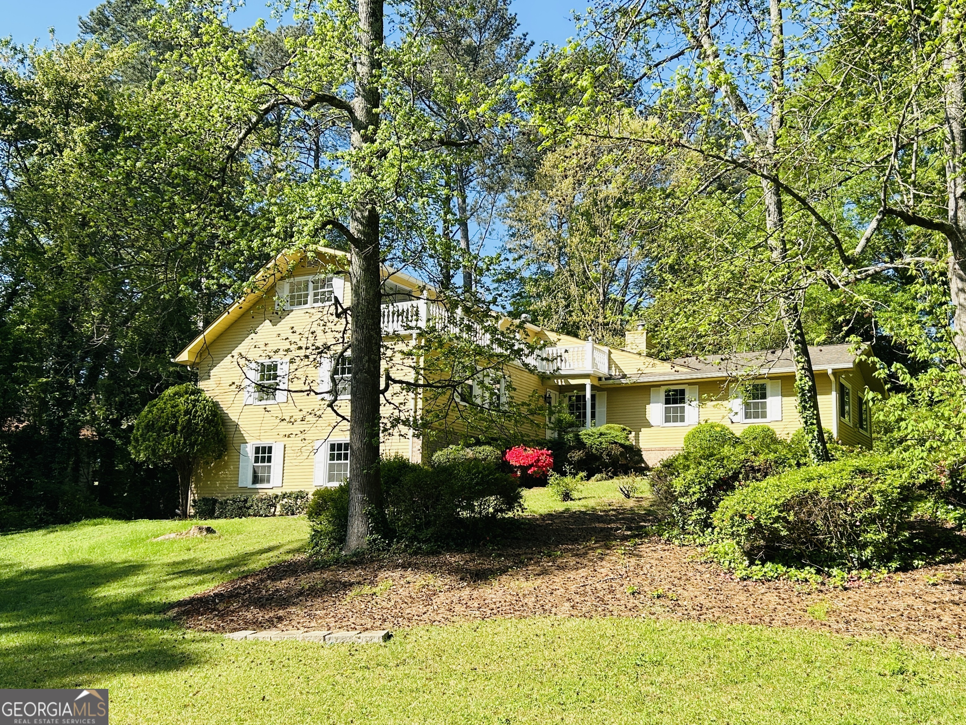 WOW! This 5 bedroom, 3 full bathroom home is a hidden GEM! All new flooring throughout, all new paint and so much more! You will love cooking in this gourmet kitchen complete with hidden pantry, stunning granite countertops, glass cabinets and undermount lighting! The kitchen looks into a beautiful den with a working fireplace! You will find a large flex room off the den and a formal living room and separate dining room on the other side of the kitchen! There are 3 bedrooms on the main floor, one being the spacious primary suite! Upstairs you will find 2 additional bedrooms with their own private full bathroom with soaking tub! Off one of the upstairs bedrooms is a beautiful veranda that overlooks the private yard! This home is complete with a 2 car garage that has TONS of storage space! This beauty sits on a large private lot, in a quiet neighborhood just minutes from Coolray Field, Northside Hospital, TopGolf, restaurants, shopping and more! Truly a must see!