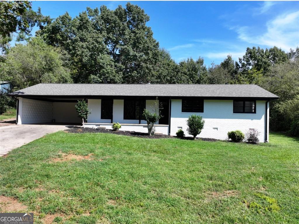 This beautifully renovated ranch-style home combines minimalist design with timeless touches, creating a space that feels both fresh and inviting. Inside, you'll find an open layout filled with natural light, sleek finishes, and thoughtful upgrades throughout. The three spacious bedrooms and two full bathrooms are finished in crisp whites for a bright, airy vibe that's easy to make your own. Every detail, from the streamlined kitchen to the polished surfaces, has been carefully chosen to offer both style and function. Outside, you're perfectly situated for peaceful living with quick access to I-985 and GA-365, making commutes to Atlanta or weekend getaways a breeze. Explore the shops and restaurants at Lakeshore Mall, enjoy time on Lake Lanier, or take in the charm of downtown Gainesville, all just minutes away. Make an offer Today!