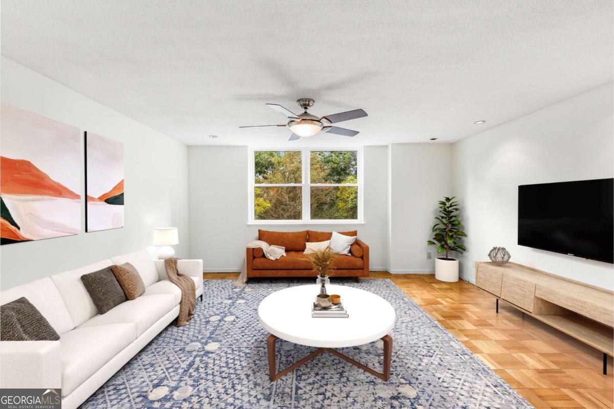 What an unbelievable value! Welcome to this fantastic home in Atlanta's desirable Buckhead neighborhood! Step through your foyer to find a freshly painted interior with charming parquet flooring extending throughout your home. The functional kitchen awaits your touch but with all the great restaurants nearby, who needs a kitchen?! The en-suite primary bathroom is updated with a walk-in shower while the Guest bathroom features the charm of original tile work. Tons of natural light flows through your windows which provide views of Slaton Manor's parklike setting which includes a BBQ area, sunny terrace and a community pool. The location of your home is superb with restaurants, shopping and entertainment a short stroll away. Your monthly HOA dues cover electric, gas, pest control, water, sewer and trash. High speed internet is also available. In addition, your unit comes with a parking space in the gated garage! Slaton Manor does NOT allow rentals, pets or smoking. Welcome Home!
