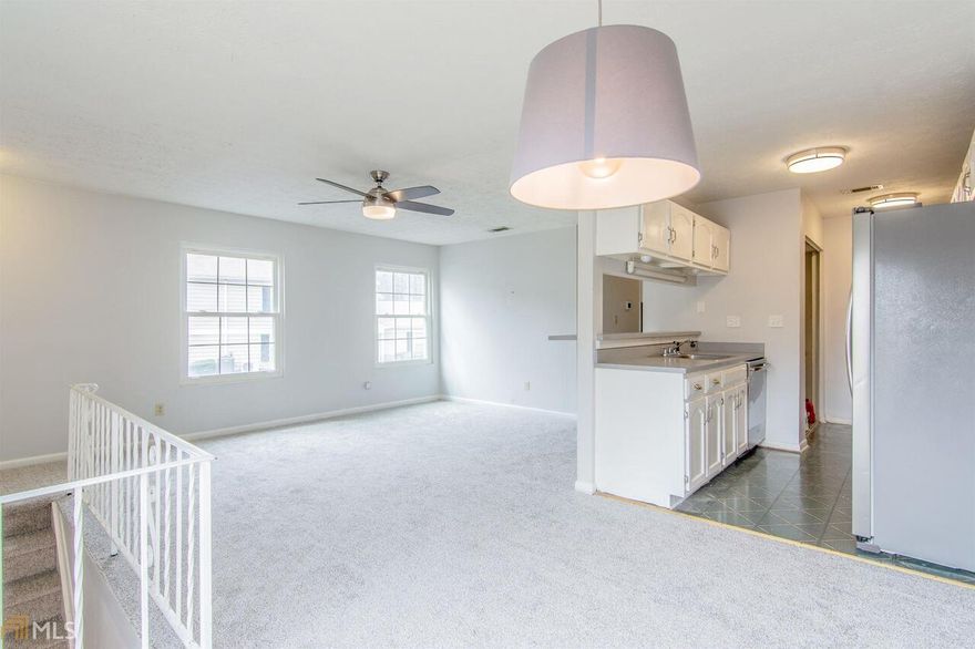 Back on Market. Buyer Financing Fell Through. Best value in the area! New carpet and paint. End unit with 1 car garage plus storage space.  Located just minutes to Marietta Square, jobs, great restaurants and shopping. Close to public transportation. Water/Sewer, and trash included in HOA. Not FHA approved. Rentals are capped.