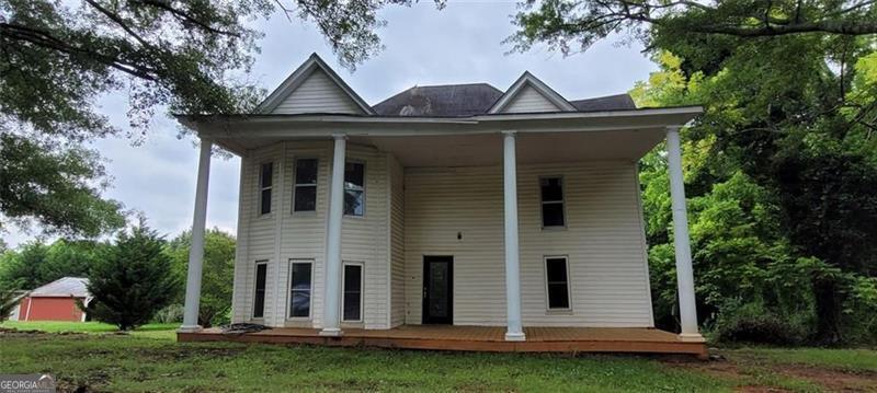 Step into a piece of history with this 1917 Colonial-style home, offering a generous 2,814 square feet of living space on a spacious 0.55-acre lot. Featuring six bedrooms and one bathroom, this property boasts classic architectural details, including newly installed fluted columns and updated windows, preserving its timeless charm. LOCATION: Situated in the heart of Temple, this home offers convenient access to local amenities and is approximately 45 miles west of Downtown Atlanta. The property is located within the Carroll County School District, serving Temple Elementary, Temple Middle, and Temple High SchooL APPRAISAL: An appraisal conducted in April 2025 estimates the property's value at $371,500 post-renovation, highlighting significant upside potential. A professional contractor's renovation estimate is available upon request, providing insight into the scope of work needed to restore this home to its former glory. FINANCING OPTION: $139,000 on a financing with 25% down available 12% interest only one year balloon appraisal 371,500 subject to rehab All inspections and due diligence must be done prior to contract. Property is sold as it is 21 day close or less. No financing contingency unless stipulated owner financing in contract 30 day listing agreement. Cash or Hard Money loan proof of funds or letter from Hard Money lender required with all offers must be accompanied with proof of viewing the property through electronic lock box verification. All inspections must be done prior to offer.
