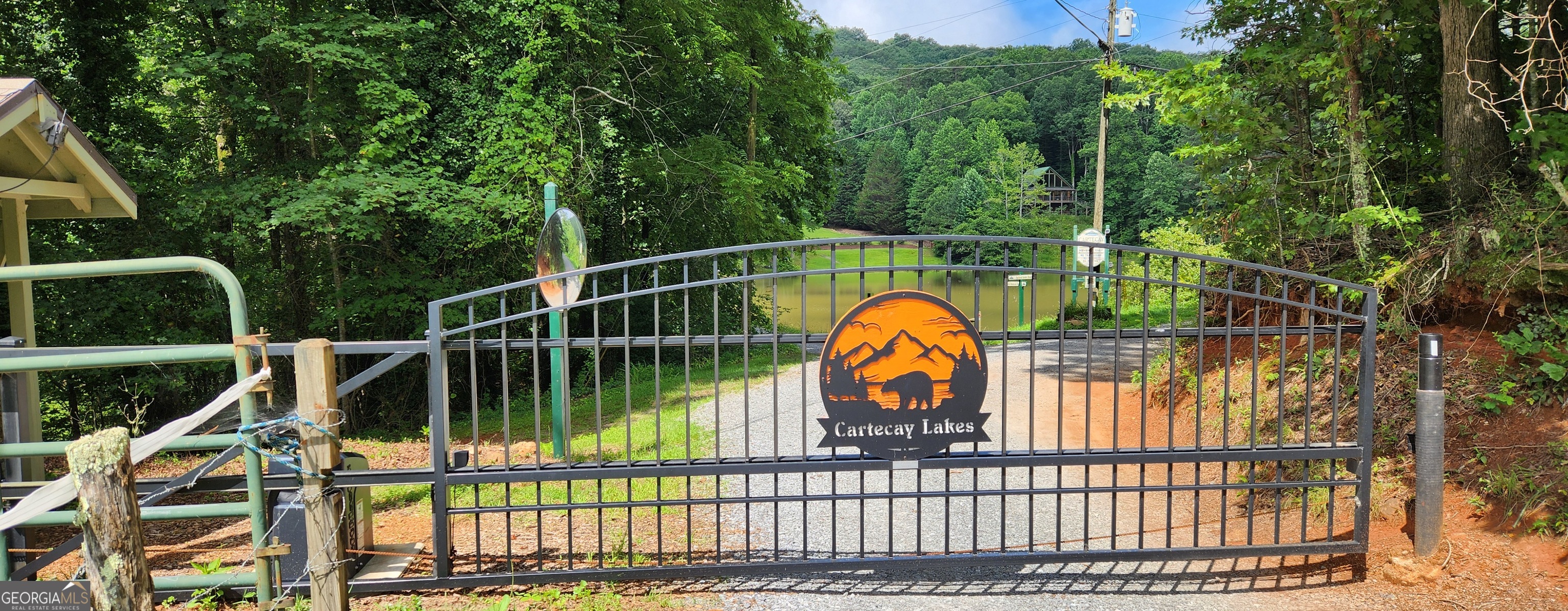 Welcome to your dream mountain escape in the gated Cartecay Lakes community of Ellijay, GA! These two combined wooded lots span an impressive 8.30 acres, offering endless possibilities for your custom mountain home or private retreat. With no time limit to build and minimal restrictions-just a minimum of 800 square feet of interior heated space-you have the freedom to design your perfect getaway. Imagine waking up to breathtaking long-range mountain views, enhanced with a bit of selective pruning, and enjoying the peace and privacy of this established gated community. Cartecay Lakes is known for its private and tranquil atmosphere, underground utilities, and minimal HOA fees, making it an ideal spot for those seeking a laid-back mountain lifestyle. Please note, short-term rentals (STRs) are not permitted, ensuring a quiet and neighborly environment. (Please request Covenants and by-laws from agent) Located just a short drive from downtown Ellijay and to local and visitor favorites like Amicola Falls, Burt's Pumpkin Farm, and several close apple orchards and wineries. Outdoor adventures await nearby with the Cartecay River and hiking trails. Don't miss this rare opportunity to own a slice of North Georgia paradise in Cartecay Lakes. Build your dream home and start living the mountain life you've always imagined! PLEASE CALL FIRST TO CONFIRM GATE CODE!