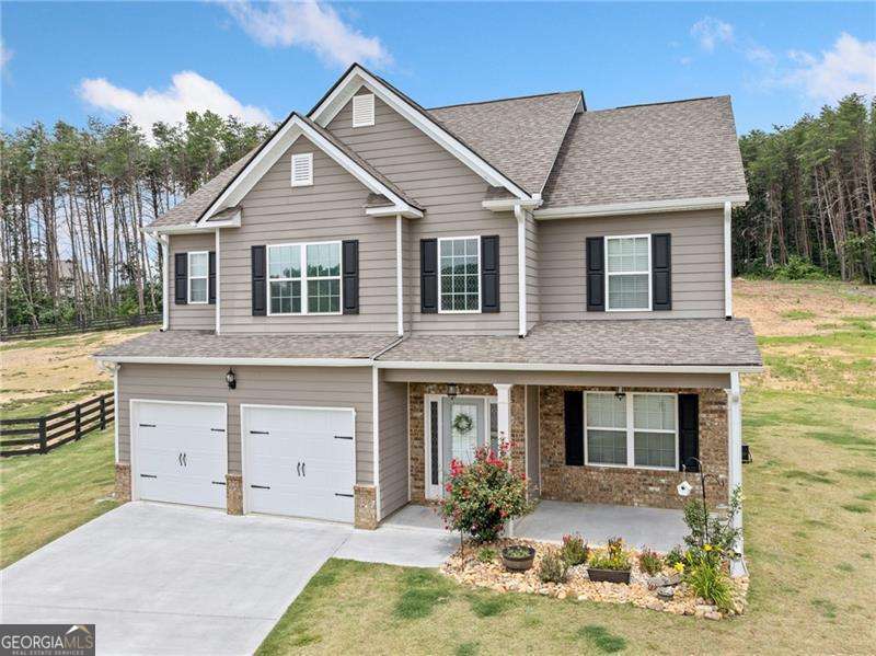 Welcome to 31 Village Trace - Modern Comfort on Over an Acre! Discover this beautifully crafted 4-bedroom, 2.5-bathroom home offering 2,410 square feet of thoughtfully designed living space, all set on a spacious 1.05-acre lot. Built in 2022, this nearly new home combines contemporary features with the tranquility of country-style living. Inside, you'll find a flowing layout perfect for both everyday living and entertaining, with spacious bedrooms, a sleek kitchen, and a comfortable open-concept design. The primary suite provides a peaceful retreat, complete with a spa-like bathroom and generous closet space. Enjoy the outdoors with plenty of room to roam, garden, or relax in your expansive yard-ideal for family gatherings or future additions. As an added bonus, we're offering $5,000 toward closing costs-a perfect opportunity to make this home yours with a little extra savings! Don't miss your chance to own this modern gem in a serene setting. Schedule your showing today!