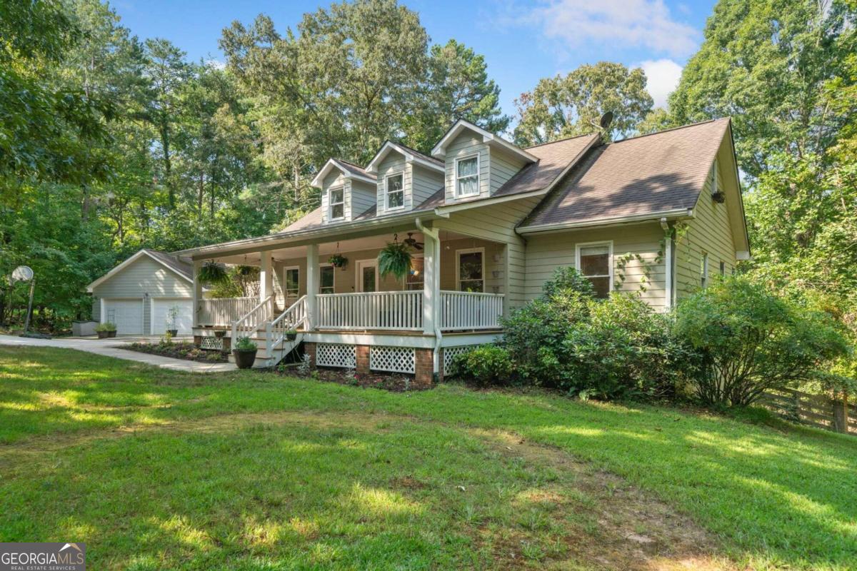 WELCOME TO THIS BEAUTIFUL TRADITIONAL HOME FOR SALE IN DAHLONEGA! Perfectly situated just MINUTES FROM DOWNTOWN DAHLONEGA, this SPACIOUS 6-BEDROOM, 4.5-BATHROOM HOME offers the ideal blend of MOUNTAIN TOWN LIVING and modern comfort. You'll love the FLEXIBLE FLOORPLAN featuring 3 BEDROOMS ON THE MAIN LEVEL, 2 LARGE BEDROOMS UPSTAIRS, a MASSIVE BONUS ROOM, and a PRIVATE BEDROOM IN THE FINISHED BASEMENT - ideal for guests, a home office, or a media space. Enjoy HARDWOOD FLOORS THROUGHOUT, COZY CARPETED BEDROOMS, and a TILED TERRACE LEVEL. The OPEN-CONCEPT KITCHEN is outfitted with WOOD CABINETS, STONE COUNTERTOPS, and a BRIGHT BREAKFAST AREA - perfect for entertaining and everyday living. Step outside to your FENCED-IN BACKYARD, WOOD DECK, and GROUND-LEVEL PATIO - an excellent setup for grilling, relaxing, or letting pets play. The home sits on a PRIVATE LOT, features a 2-CAR DETACHED GARAGE, and runs on a PRIVATE WELL, offering added independence and savings. This is a rare opportunity to own a LARGE FAMILY HOME in one of North Georgia's most desirable small towns. If you're looking for HOMES FOR SALE IN DAHLONEGA GA with space, privacy, and proximity to DOWNTOWN DAHLONEGA, this one is a MUST-SEE!