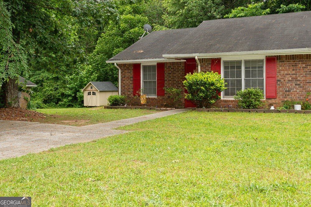 Photo of 8165 Magnolia Drive, Jonesboro, GA 30238 (MLS # 10872032)