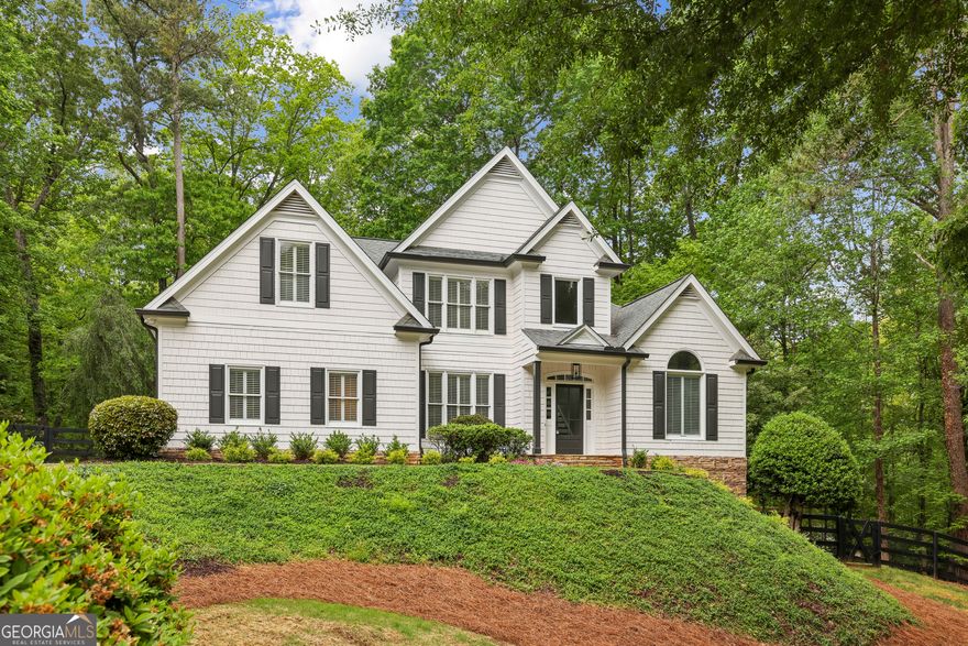 Welcome to the kind of home that instantly feels like the one. Tucked away at the end of a quiet cul-de-sac, this house offers the peaceful escape you didn't know you needed-while still being just minutes from the buzz of Avalon and Downtown Alpharetta. From the moment you step through the front door, light pours in through soaring windows, welcoming you with warmth and space that feels open yet cozy all at once. Whether you're hosting family dinners in the beautiful new kitchen, unwinding on the spacious covered patio, or enjoying a quiet morning by the pool, every corner of this home is designed for comfort, connection, and joy. Downstairs, the finished basement offers the perfect retreat for guests or game nights, while upstairs, the updated touches and fresh feel throughout make every day feel like a fresh start. And there's even more to love-this home has been thoughtfully updated with a brand-new kitchen including gorgeous countertops, all-new light fixtures and faucets, fresh interior and exterior paint, newly refinished hardwood floors, new bathroom countertops, and a stylish new vanity in the powder room. The new HVAC system on the main level was installed in 2023 and on the 2nd floor in 2016, it comes equipped with an air purifier for enhanced indoor comfort. Outside, you'll find a new pool liner and pool pump installed in 2025, plus a new irrigation controller and sprinklers added in 2024-making this home truly move-in ready, inside and out. Surrounded by calm, nestled in one of the most serene spots in the neighborhood, this home is more than just a place to live-it's where memories are made, milestones celebrated, and life feels just a little bit easier. Come experience it for yourself-you might never want to leave.