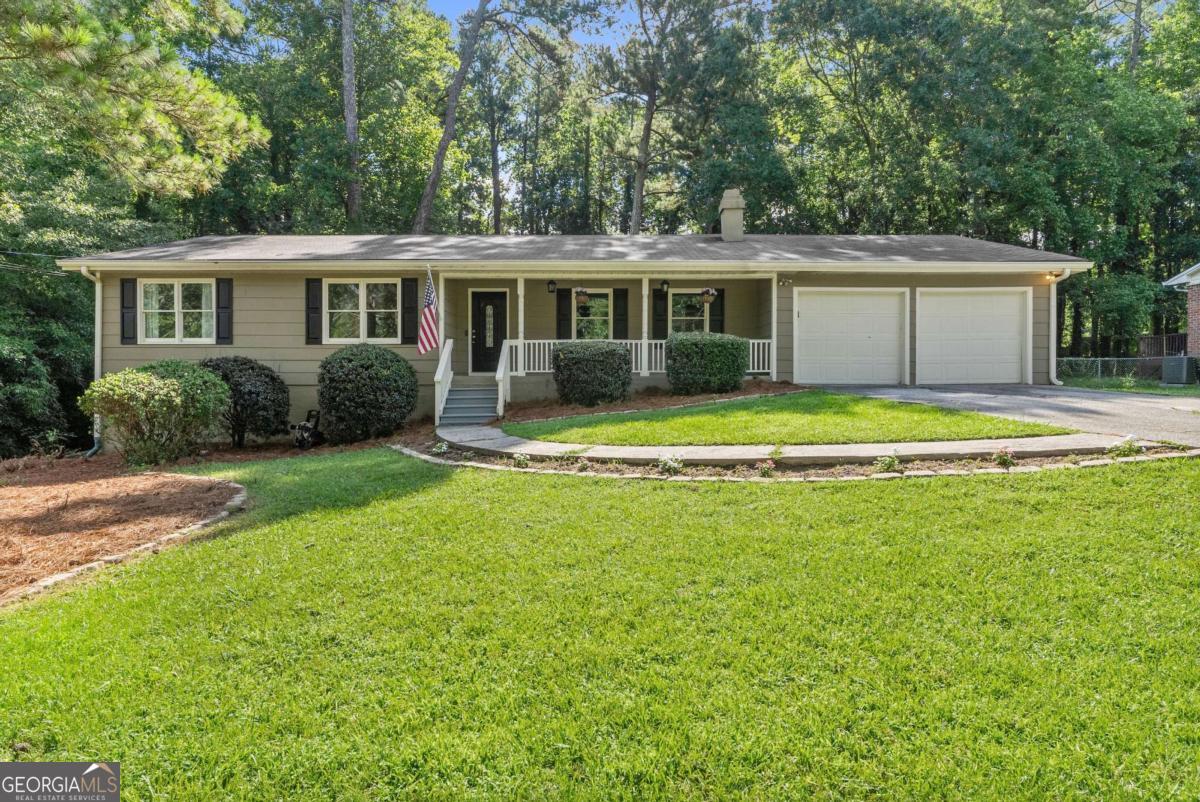 Move-in ready and beautifully updated, this rare stepless ranch in the heart of East Cobb offers the perfect combination of style, functionality, and location - with no HOA!Featuring an open-concept floor plan, this home includes refinished hardwood floors, spacious living areas, and a bright, modern kitchen with granite countertops, soft-close shaker cabinets, and stainless steel appliances. The primary suite features private deck access, a dual vanity, and an updated tile shower. A versatile fourth bedroom works perfectly as a second primary suite, guest room, or home office. Enjoy the outdoors in the level, fenced backyard - ideal for kids, pets, or entertaining. Other upgrades include newer energy-efficient vinyl windows and access to optional swim/tennis amenities. All of this located just minutes from top-rated East Cobb schools, shopping, dining, and the East Cobb Aquatic Center. Whether you're a first-time buyer or an investor, this is a must-see opportunity in one of Cobb County's most sought-after areas!