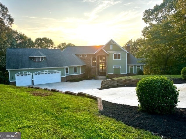 LAKEFRONT PROPERTY including an Awesome Home totaling 6500sqft. 300' of "Deep Waterfront", 30 miles of Amazing Views of both South Carolina and Georgia shorelines and mountains and 2 additional buildable lots with Water Views. Is there anything more you could want? The home itself is an entertainers dream. A truly one of a kind home that sits up high on Lake Hartwell. When entering the grand foyer, your eyes immediately are drawn to the breathtaking views of Lake Hartwell and the Georgia and South Carolina mountains through floor to ceiling windows of the great rm. Multiple rear timbertech maintenance free decking for you to enjoy the amazing 30 mile views and the incredible sunsets dipping over the mountains all year long. This 6500 sqft. home on over 3 acres consists of 6 Bedrooms, 4.5 Baths. On the main level is the open concept kitchen with SS GE monogram appliances, Granite countertops and high-end cabinetry. Your owner suite w/fireplace, morning rm, a dream walk-in closet and your master bath with a 2 person whirlpool tub. Also boasting on this level is your open great rm, large Laundry rm, coat rm and walk-in pantry with your oversized 3 car garage. Second Floor has 3 bedrooms, bathroom and a bonus rm with living area. Lower level has 2 bedrooms, 2 bath with family rm and entertaining area boasting a custom bar, pool/ping pong table and wine cellar. Outside is a huge patio area 75ax20a 2 levels with summer kitchen and a 8' fire pit to roast those marshmallows! 300' of Waterfront with max dock (28x40) and 15,000 boat lift, storage shed, weber grill and maintenance free composite decking. 2-Yamaha VX Deluxe Jet Skis and Regal 3200 Bowrider are also available.