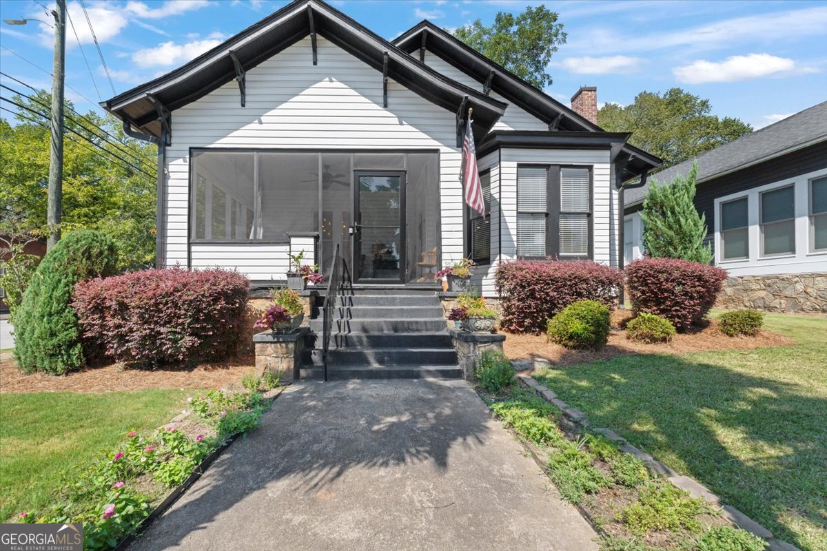 Welcome to this beautifully updated cottage located less than a quarter mile from the heart of the historic Covington Square! Bursting with character and modern comforts, this home offers the perfect blend of classic charm and turnkey convenience. Step onto the inviting summer porch for all seasons-an ideal spot to enjoy your morning coffee or unwind in the evenings. Inside, you'll find original hardwood floors that add warmth and authenticity throughout. The spacious master suite features a large bedroom and an updated bath complete with a double vanity, creating a true retreat. This home has been completely remodeled, including a recently replaced HVAC system, ductwork, and hot water heater, ensuring peace of mind for years to come. The fenced backyard provides privacy and space for entertaining, gardening, or pets. Positioned directly across from the Covington Welcome Center, this home also boasts a strong short-term rental history, making it an excellent investment opportunity or charming full-time residence. Don't miss this opportunity to own a piece of Covington charm with every modern upgrade already done for you!