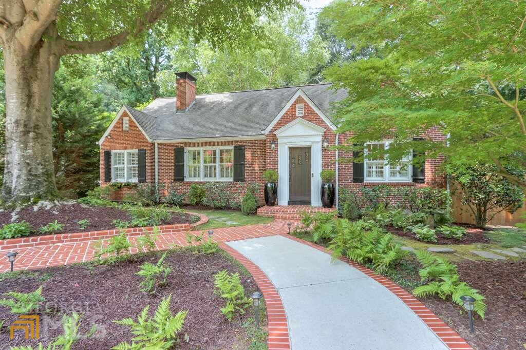 Chastain Park Renovated 3 Bedroom, 3 Bath, Brick Cottage abounds with charm. Open floor plan. Living Room with fireplace, study and dining room. Spacious kitchen open to family room. White cabinets, granite, stainless appliances. Large eat in island. Family room with fireplace that opens to large deck overlooking private flat fenced yard. Bedroom on main. Beautiful renovated marble bath with tub and shower. Spacious owners suite with fireplace and walk in closet. Spa bath with separate shower, free standing Italian tub. Dual vanities with oceanside glass tile. Laundry up. 3rd bedroom and bath. Finished room in basement for exercise, man's cave, or office. Basement area great for storage. 2 car detached garage. Guest parking front and back. Circular drive. Walk to Chastain. Pool, tennis, golf, horse park, playground, amphitheater, and sports field.