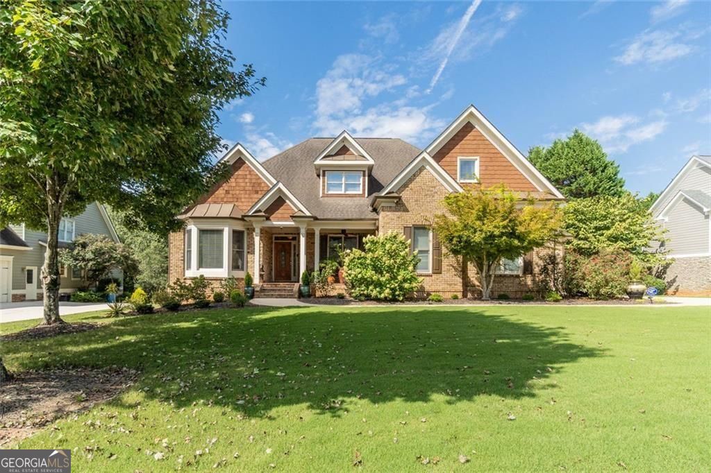 Pictures don't capture the full beauty of this home! It is one that you MUST SEE in person!! Schedule an appointment today!! Discover this exquisite executive-style custom-built home situated in a lively swim, tennis, and lake community. This remarkable property is part of a neighborhood celebrated for its esteemed schools and year-round family-friendly events, perfectly blending luxury with community living. Featuring a three-car garage and an eye-catching three-sided brick exterior adorned with charming cedar shaker accents, this home offers impressive curb appeal. The established landscaping, enhanced by a convenient irrigation system, ensures year-round beauty with minimal upkeep. Upon entering, you'll find a private office ideal for remote work and a spacious formal dining room. The heart of the home is the expansive great room, complete with a cozy fireplace that creates a warm atmosphere. The eat-in kitchen showcases solid wood cabinetry, a gas cooktop, double oven, and coffee bar, all highlighted by stunning granite countertops. A bright adjoining keeping room leads to a large deck that overlooks a private backyard, perfect for serene outdoor dining while easily serving from the kitchen. The main floor is adorned with gleaming hardwood floors that are flooded with natural light, adding warmth and elegance to every space. The luxurious primary suite on the main level serves as a tranquil retreat, featuring a spa-like bathroom with a jetted tub, spacious walk-in shower, and a generously sized closet for ample storage. Upstairs, you'll find three roomy bedrooms, one of which doubles as a bonus room, and two additional full bathrooms, providing plenty of space for the whole family. The unfinished terrace level presents endless possibilities for customization, whether you envision an in-law suite, guest quarters, or the ultimate entertainment space. This area has the potential for a full bathroom, bedroom, media room, and more! With abundant attic and basement storage, you'll have plenty of room for keepsakes and seasonal decor. Step outside to your private, park-like backyard, where the soothing sounds of nature and picturesque seasonal views await. This meticulously maintained lawn offers an ideal setting for outdoor living and enjoyment. Conveniently located near major highways for easy commuting, as well as a variety of shopping and dining options, you'll also enjoy nearby parks, walking trails, and recreational facilities, providing endless fun and local events. This dream home truly embodies a perfect blend of luxury and functionality for a personalized lifestyle.