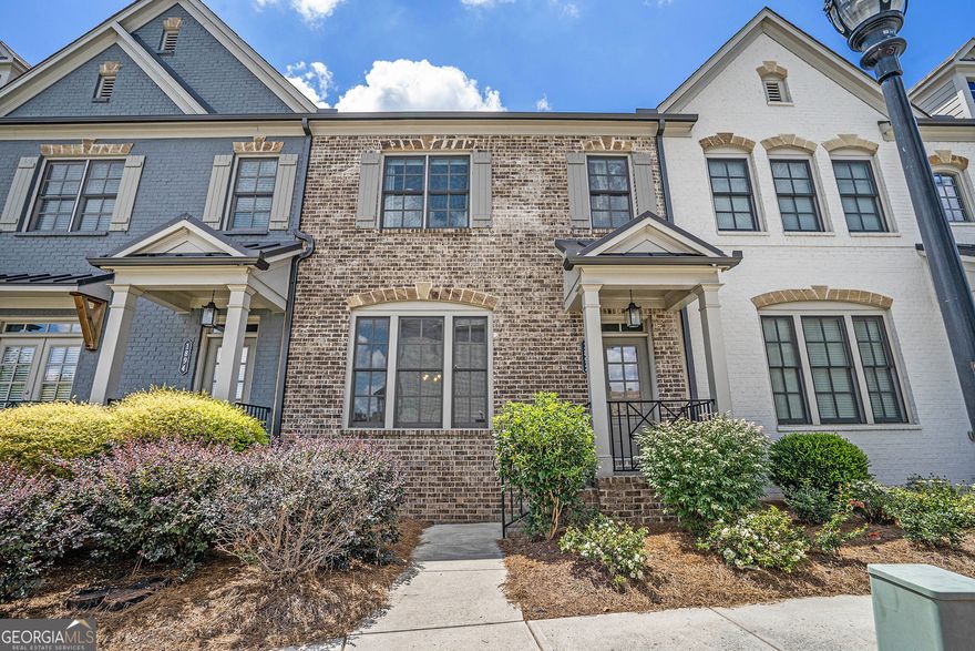 Welcome to the best work-life-work-play location in the city: Skyland Brookhaven. This is a three-bedroom, 3.5 bathroom townhome with a basement-interior design  & paintings by Marguerites on Dresden. Step into a townhome designed with sophistication and elegance - this spacious residence is in the highly sought-after Skyland Brookhaven community. Ideally positioned, this home is surrounded by lush green spaces. Offering great views of the neighborhood. As you step inside the open concept living area, take note of the hardwood flooring throughout the home, the built-in bookcase, the fireplace, and the grass cloth wallpaper in the bar. A gourmet kitchen with stainless steel appliances, a custom vented hood, a gas range, and subway tile backsplash, featuring shaker-style cabinets, an upgraded Nest thermostat, and custom electronic window shades. A large island is perfect for gathering around and entertaining. Upgraded from builder grade to luxury lighting throughout the home. Step out onto your deck for morning coffee or to relax in the evenings. Powder room: upgraded lighting and mirror. Custom runners are installed on all stairs, along with a matching piece on the landing of the entire top floor, as well as the kitchen. Primary ensuite, upgraded fixtures, lighting, mirrors. Primary bedroom: custom-built closet designed by Artisan Closets, double-tray ceiling. Two other spacious bedrooms are on the second floor. Enjoy the second-floor laundry as well. The lower-level features a full bathroom and a basement that can be customized for your specific design, including office space, a gym, or a playroom. Sklyland Brookhaven offers a clubhouse, swimming pool, playground, walking trails, and a dog park. The Skyland Brookhaven community provides an outstanding work-life balance, with easy access to I-75 / 85, Markets, doctors, Recreation, and nightlife. Be the first to take in what this home has to offer.