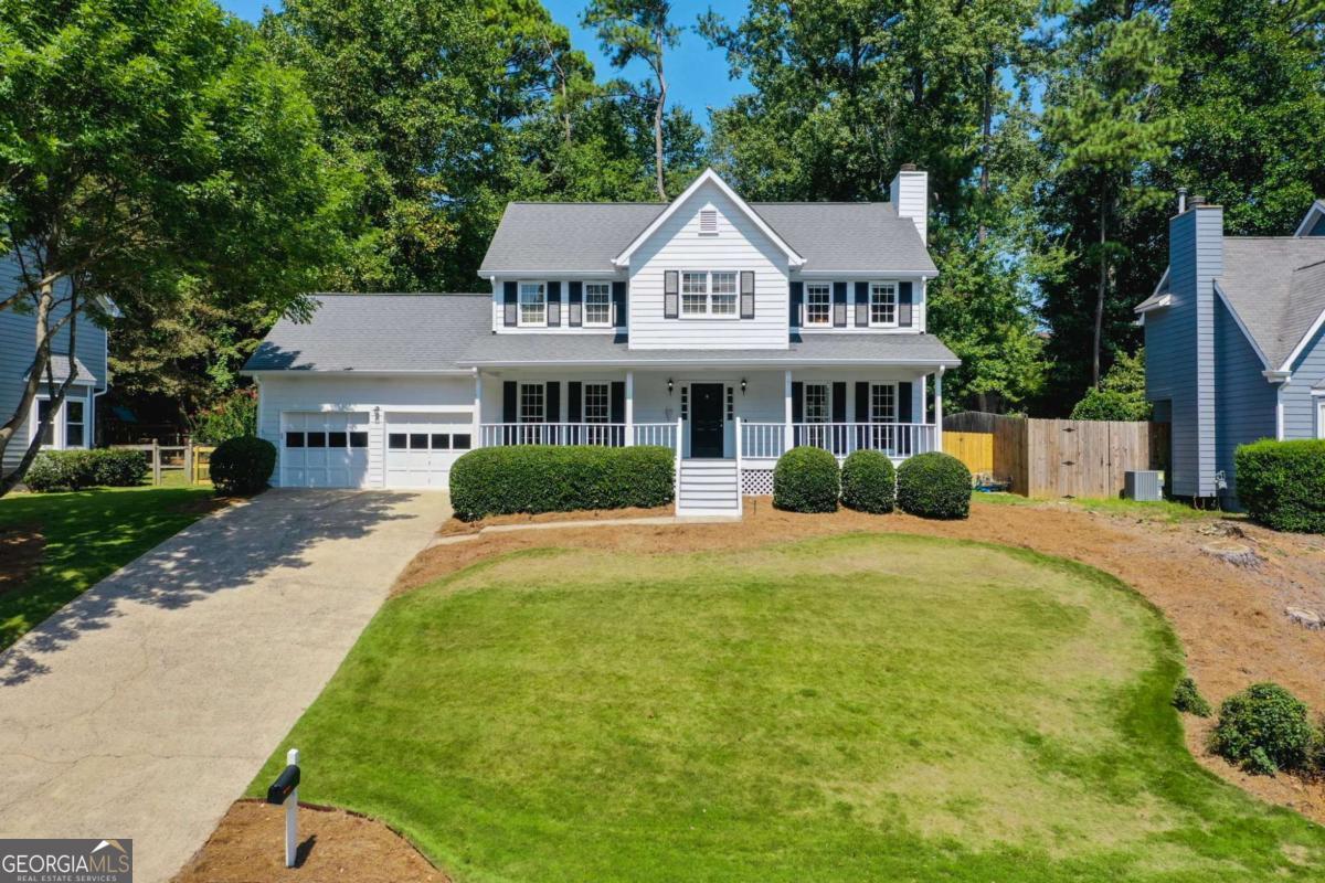 Welcome to vibrant Johns Creek! Beautifully updated and freshly painted, this home 4 Bedroom 2.5 Bath home is ready for its next owner! Inside, warm hardwood floors flow across the main level and continue upstairs with new engineered wood, creating a seamless, modern feel. The kitchen shines with quartzite countertops, two pantries and a view to the large fenced backyard with a brand new deck for grilling and outdoor entertaining. This home includes a welcoming fireside family room, a formal dining room that could easily be used as a home office or flex space. A bright and cheerful sunroom with natural gas and HVAC tie in. The primary bathroom has been completely renovated with a beautiful dual sink vanity and a spacious walk-in closet offers ample storage for all your wardrobe needs. This floor plan also offers easy access to a nursery or home office right off of the primary bedroom. There are two additional spacious bedrooms and an updated secondary bathroom for everyday convenience. The spacious laundry and mudroom features cabinet storage and a convenient drop zone for organization and the option of either gas or electric connections for your dryer. The garage is spacious with a workshop area, shelving, tall ceilings and additional attic storage. Smart touches include exterior lighting automation, 5.1 surround wiring, a Ring doorbell, and a smart thermostat setup and landscape lighting add warmth and curb appeal. Behind the scenes, the essentials have been covered: encapsulated crawl space, newer HVAC, water heater, roof vent, electrical updates, and more. With its blend of modern upgrades, transferable warranties, and lifestyle-ready features, this home offers peace of mind today and long-term value for tomorrow. Abundant parks and entertainment await in Johns Creek! Close to several parks; Newtown Park (within walking distance and sidewalks all the way to the park), Ocee Park, Autrey Mill Nature Preserve and Heritage Center and Cauley Creek Park; Arts, Culture, Shopping, Dining and Nightlife, there is something for everyone!