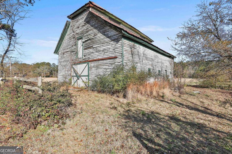 Beautiful acreage located in one of the most highly sought-after locations just South of Atlanta. This property features 16.8  acres of mature hardwoods and pines, a large barn at the front of the property and a creek towards the back. The majority of the property offers level topography, with plenty of buildable areas. With over 285 feet of road frontage along HWY 92, building and development opportunities are endless.  The property is and has been used by the owners and family for many years for hunting as well as the location for a Wedding in 2016.  Neighboring properties may be available to purchase with this sale including an additional 9.49 acres. The convenience offered with the location of the property is prime! Located only 5 miles to Atlanta Metro Studios in Union City and 5.9 miles to Trilith Studios. 2.7 miles to I-85 and 14 miles to Hartsfield-Jackson International Airport. Fayetteville, Tyrone, Peachtree City, and Newnan are all within a 25-minute commute. Commercial and industrial developments close by.  Currently on a 10 year Agricultural Covenant which provides a substantial tax break.