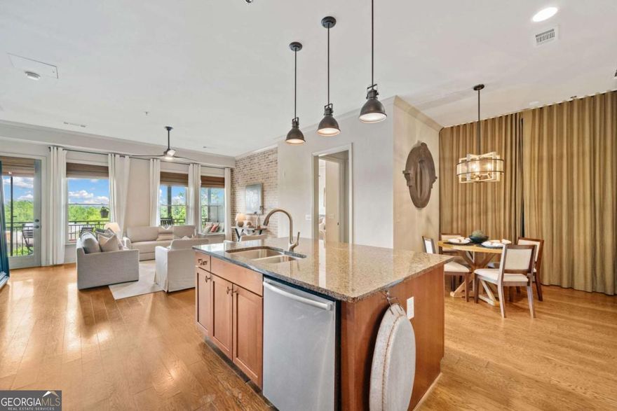 Come live the lifestyle you deserve in Downtown Woodstock! Welcome to this stunning 2-bedroom, 2-bathroom condo in the highly sought-after Chambers Street building in the vibrant core of Downtown Woodstock -- ranked as one of Georgia's best places to live! This beautifully appointed condo features soaring ceilings; tons of natural light; a full suite of stainless steel kitchen appliances; new HVAC; and custom feature walls that add warmth and character to the open-concept great room and dining area. The views from the balcony patio are absolutely to die for, and will serve as the perfect outldoor living space you can retreat to even while living in the heart of it all. Whether it's morning coffee; a mid-day work-from-home conference call; or an evening cocktail admiring the beautiful views, this patio may end up being your absolute avorite space of this gorgeous home. Enjoy an easy & convenient lifestyle with restaurants, coffee shops, brewries, boutique shopping, and live music venues just steps from your front door. Tucked away behind the building, you'll also find a private amphitheater, serene park space, and cozy firepits - plus access to the residents-only, resort-style pool. The condo includes two deeded parking spaces in the gated parking lot, providing ultimate convenience. Top-rated Cherokee County schools, with easy access to I-575, Woodstock Outlets, wineries, and scenic trails. The brand-new Downtown Woodstock parking deck makes it easy for your guests to visit. Whether you're looking for a full-time home, second property, or an excellent rental investment, this condo checks every box. Schedule your private tour today and experience everything Downtown Woodstock living has to offer!