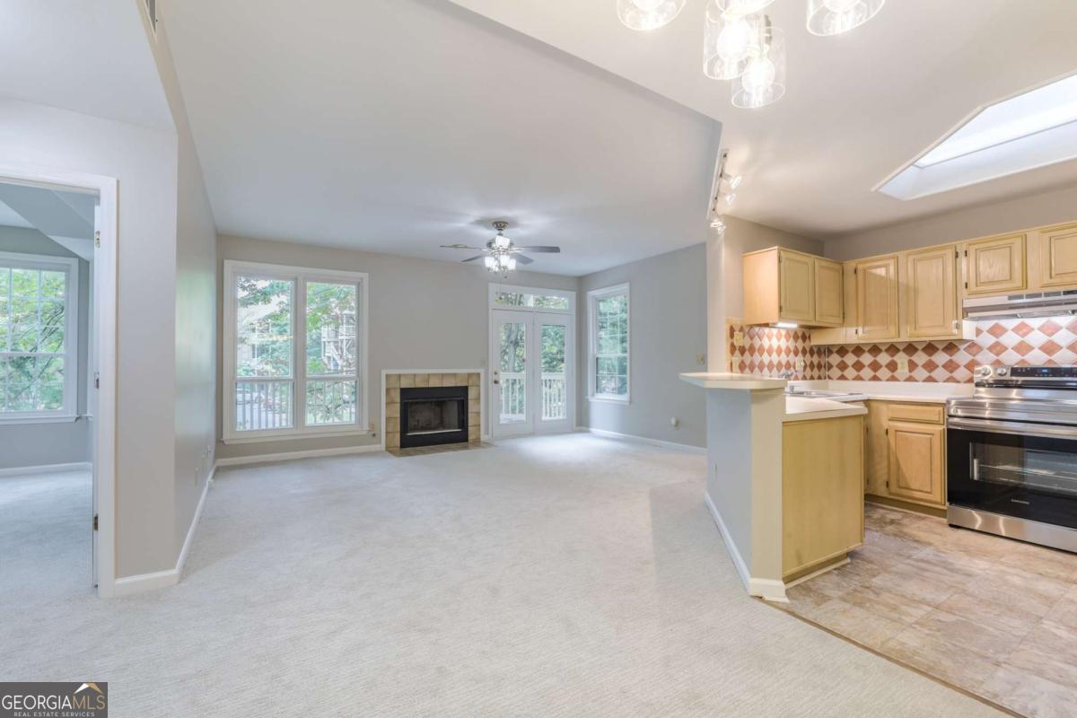 This lovely one bedroom condo in downtown's idyilic McGill Park has fresh paint and new carpeting throughout the unit. An open-concept plan leaves the main living areas soaked in sunlight, including the living room with fireplace, dining area + kitchen with brand new stainless appliances and a tile backsplash. The unit's bedroom is well-sized with a pass-through closet with direct access to the bathroom, featuring tile tub surround. There's a large patio and storage closet, too. This beautiful community is full of mature trees and amenities including pool, gym + EV chargers.