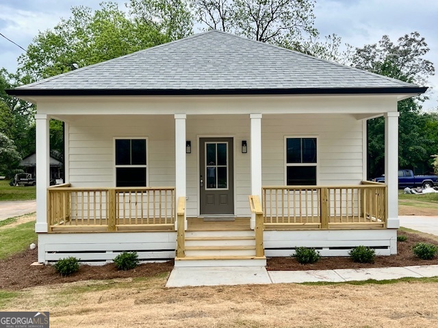 New construction 100% completed and ready to move in. New Privacy fence added. This home is less than 1/4 mile to downtown Social Circle. This quality new construction home features Hardie siding and front and back porches. Inside you will find LVP flooring in the main living area with tile in the bathrooms and carpet in the bedrooms. The kitchen features granite countertops and custom cabinets along with a breakfast bar and dining area. The master bathroom has his and her sinks along with a large walk in shower big enough for 2.Take advantage of this great opportunity to move to Social Circle. Be sure to check out this list of additional upgrades. 1. Granite kitchen countertops. Granite countertops in bathroom. 2. Recessed lighting. 3. 4th Bedroom/ Office 4. Transom windows added to all bathrooms for daylight. 5. Large walk in closet in owner's suite. 6. Separate Laundry Room. 7. Covered back porch for entertaining.