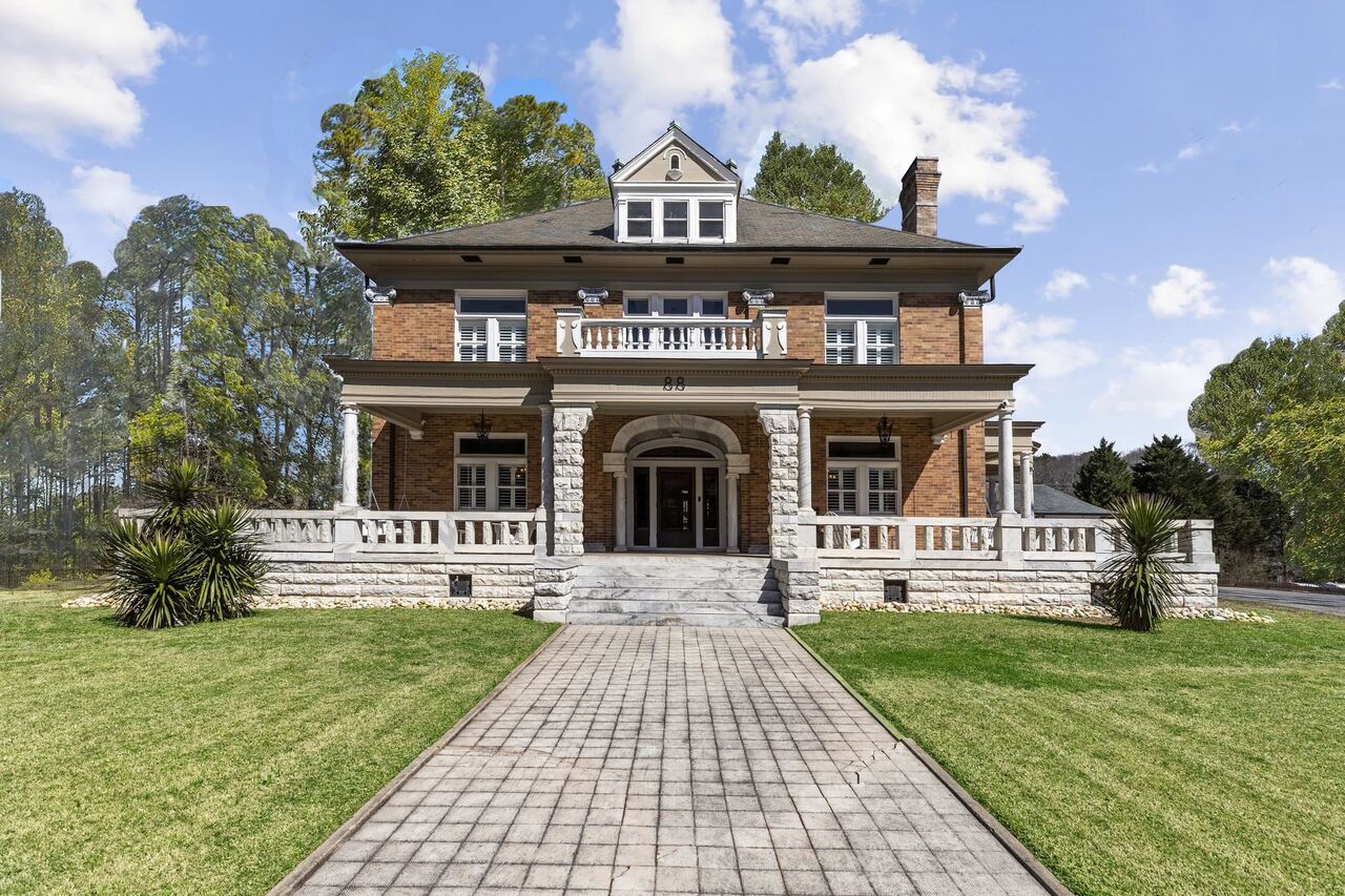 FABULOUS HISTORICAL MASTERPIECE on a 1.1+/- acre lot w/separate guest house.  Beautiful manicured lawn within walking distance of downtown Newnan! Opulence abounds in this magical mansion born of exquisite custom marble, handcrafted woodwork & European style. This turn of the century estate was constructed by Edwin Marcus Cole for his bride Mattie Tate in 1914 & is richly appointed on all levels with only the finest materials.  The exterior is constructed with brick, marble & granite. The custom brick & marble exterior & entryway welcomes you to a grand foyer with beautiful carved mahogany Corinthian columns & magnificent wood inlaid pocket doors plus sitting rooms on each side.  Oversized dining room w/fireplace with custom hand-painted imported French mural done by Jean Zuber. Unique antique lighting fixtures. Chef's kitchen has commercial stainless appliances, marble countertops & imported tile flooring from Italy. Master suite has a fireplace & walk-in closet with built-ins. Master bath has his (granite top) & hers (marble top) vanities & fabulous tiled shower w/body jets & frameless glass!  Oak hardwood flooring throughout, Plantation shutters, newer HVAC systems. Completely rewired home in 2020 w/400 amp box. Smart house technology. Newly renovated guest house constructed in the early 1900's complete with a kitchen, 2 fireplaces, spa bath & private stone patio.  Outdoor living galore includes multiple porches framed with granite balusters, private park-like like fenced backyard w/fantastic KOI pond with waterfall & flagstone courtyard. Partial unfinished daylight basement.