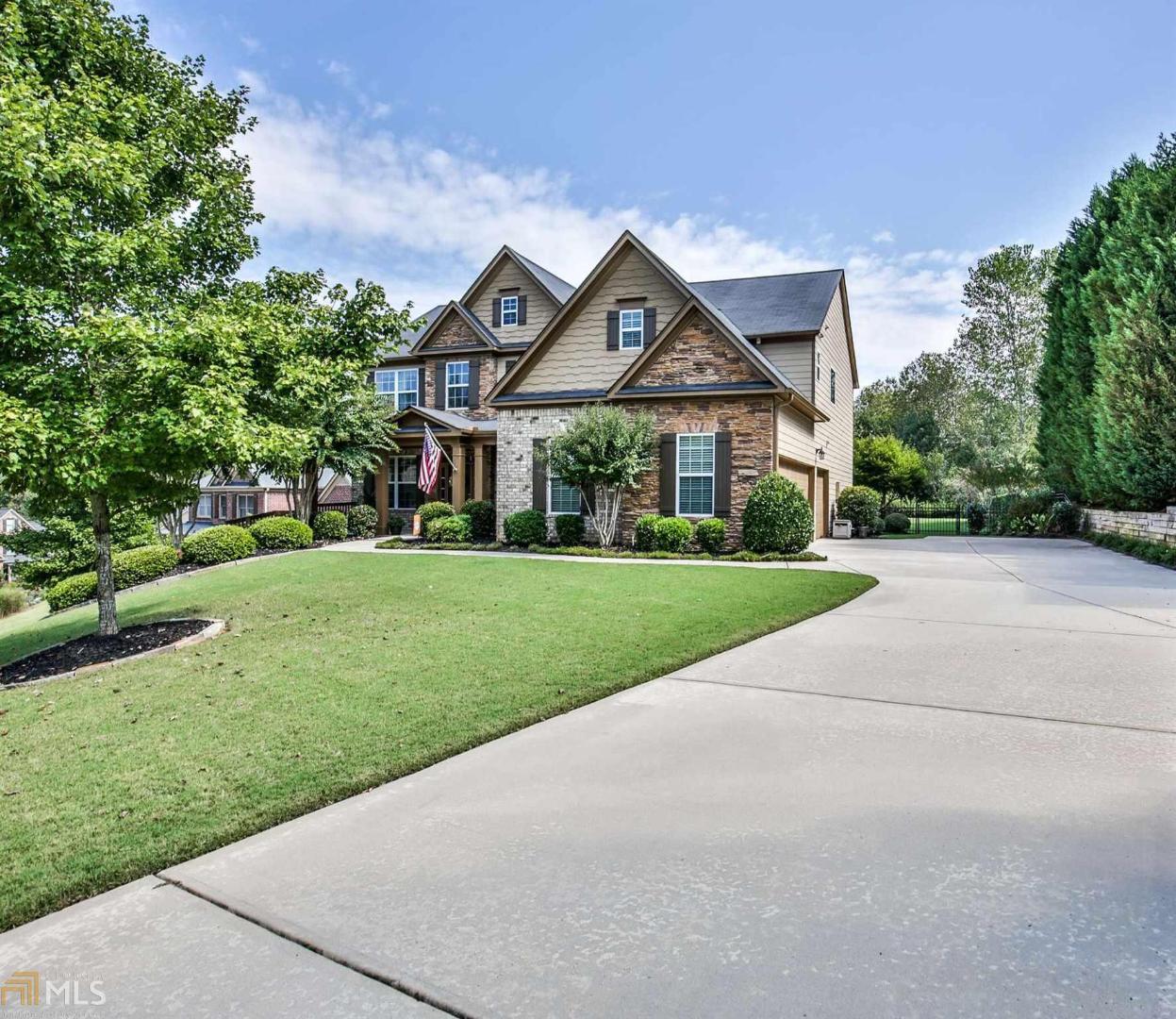 Price reduced!This home is a must see! Meticulously maintained, this home has a three car garage and a huge level and private backyard that is completely fenced. Inside boasts hardwood floors throughout and an entertainer's dream kitchen. Huge wrap around island that overlooks the family room. Bedroom on main with full bathroom perfect for a guest room, office or play room. Upstairs the master bedroom is oversized with a sitting room and overlooks the serene backyard. Master closet is very spacious. The three extra bedrooms upstairs are generous size.