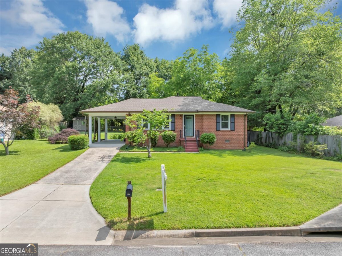 Welcome to 701 Green Acres! This beautiful cozy Ranch home sits in a quiet community with "NO HOA" in the heart of Smyrna GA where all your activities, shopping and night life is accessible. This ranch home is a 3bedroom /1bath with major Upgrades-Let's start with all New plumbing and electrical through out the home, New high in Pella windows-Hurricane/UV resistant, New paint inside and out, New exterior doors, New Bay window in kitchen, New tankless gas water heater, Completely renovated bathroom-New vanity, lighting, tile flooring. Let's continue, follow me! All new top end appliances, New quartz countertops & New sink and faucet in kitchen, New high tech ceiling fans, New 5 panel doors & New crown molding in all rooms, New attic stairs and lighting in attic, New attic insulation, All new outside water spigots, New concrete slab & steps for carport, All new copper water lines-New drain & sewer lines, New seamless gutter w/leaf guard- Never need cleaning, Facias & soffits replaced w/PVC- Never need painting, Roof close to 6 years, and last but not least! A storage building with a leveled back yard. Talk about a home that is well put together, making it TURN KEY! COME AND SEE!!!