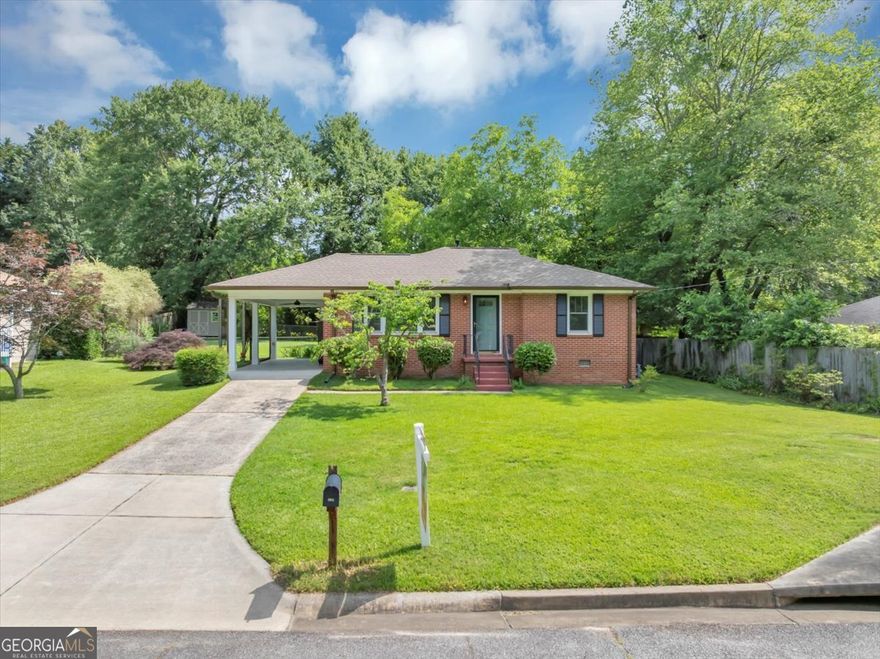Welcome to 701 Green Acres! This beautiful cozy Ranch home sits in a quiet community with "NO HOA" in the heart of Smyrna GA where all your activities, shopping and night life is accessible. This ranch home is a 3bedroom /1bath with major Upgrades-Let's start with all New plumbing and electrical through out the home, New high in Pella windows-Hurricane/UV resistant, New paint inside and out, New exterior doors, New Bay window in kitchen, New tankless gas water heater, Completely renovated bathroom-New vanity, lighting, tile flooring. Let's continue, follow me! All new top end appliances, New quartz countertops & New sink and faucet in kitchen, New high tech ceiling fans, New 5 panel doors & New crown molding in all rooms, New attic stairs and lighting in attic, New attic insulation, All new outside water spigots, New concrete slab & steps for carport, All new copper water lines-New drain & sewer lines, New seamless gutter w/leaf guard- Never need cleaning, Facias & soffits replaced w/PVC- Never need painting, Roof close to 6 years, and last but not least! A storage building with a leveled back yard. Talk about a home that is well put together, making it TURN KEY! COME AND SEE!!!