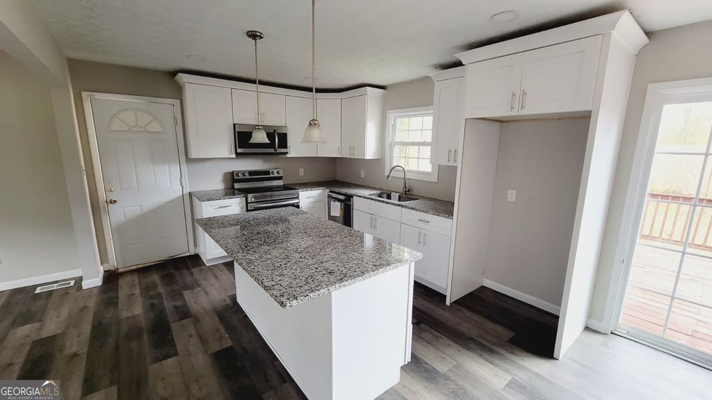 Photo of 595 Lakeridge Drive SE, Conyers, GA 30094 (MLS # 10710846)