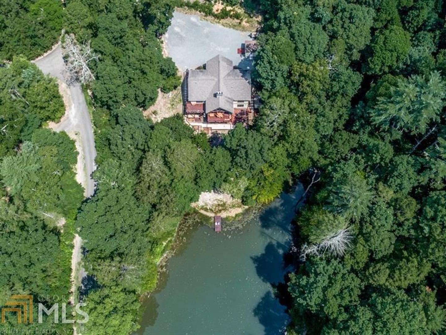 Wonderful ranch home on small pond in quiet gated community. Owners have added/updated much. Main floor has split bedroom plan, huge Master Bedroom & Master Bath w/walk in shower, dual vanities & jetted tub; soaring great room has full rock fireplace. Well designed kitchen w/center island/breakfast bar & open dining area that can accommodate seating for 12. Ladies will love the huge laundry room w/ lots of custom cabinets and storage. Inviting good sized loft has many opportunities. Full beautifully finished basement. Relax on your covered porch while gazing