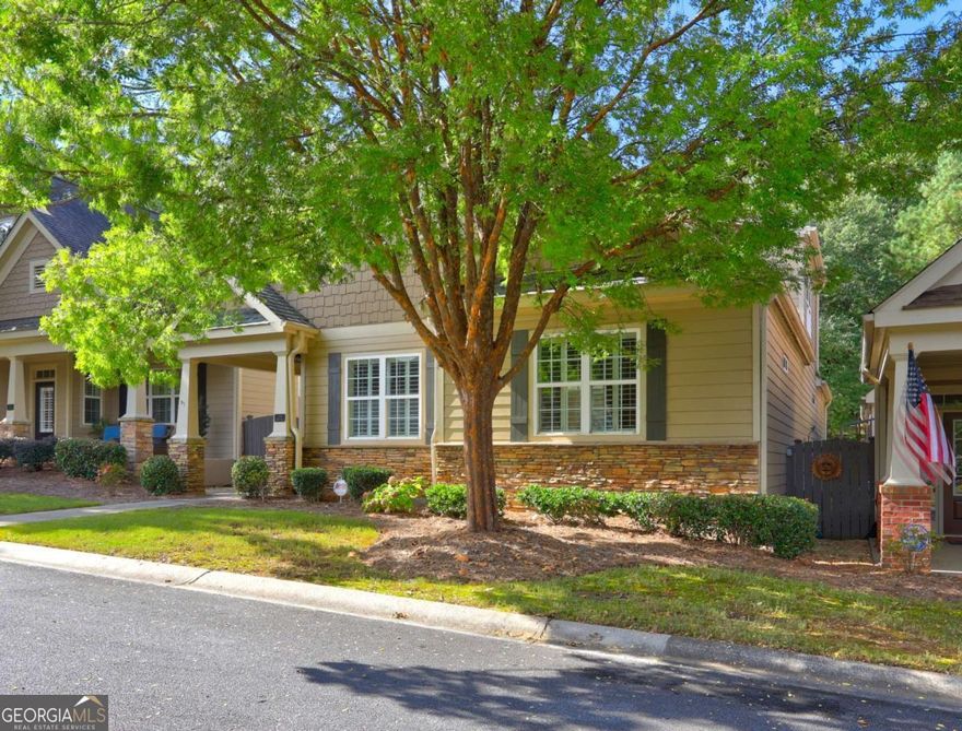 Discover one of the largest homes in The Glens at Mountain Brook, offering 2,100 sq. ft. of thoughtfully designed living space. The main level welcomes you with garage access leading directly into the spacious kitchen, complete with abundant cabinetry, a built-in breakfast nook, and seamless flow into the dining room-perfect for entertaining. The oversized primary suite is conveniently located on the main level, featuring elegant trey ceilings, a luxurious bathroom with dual vanities, and a generous walk-in shower. The inviting living room boasts soaring built-in bookshelves framing a beautiful gas fireplace, creating a warm centerpiece for gatherings. An additional main-level bedroom and full bath provide private space for guests, while a versatile flex room is ideal for a den or home office. Upstairs, you'll find another bedroom and full bath, a cozy sitting area, and walkable attic storage. With its spacious layout and prime location, this home is an exceptional find for anyone seeking comfort, functionality, and style.