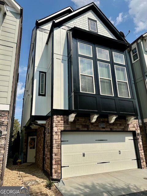 Welcome to the long list of NEW at 3005 Devoncroft ST. This home has had a MAJOR refresh! Starting with a stunning new complete paint job, BOTH INSIDE and OUTSIDE! The updates do not stop there! New lighting throughout, New Fans, NEW kitchen backsplash, New frameless glass primary shower enclosure, New glass shower doors in the lower bath, New designer curated feature walls, NEW closed-in third-floor loft to create a large Third bedroom with TWO walk-in closets or a fantastic office or media room, and the sellers replaced the carpet on the third floor as well. Even the garage got a brand-new epoxy floor covering. This home has become a SHOWSTOPPER! With three bedrooms and two and a half baths, this is the home you have been looking for. The soaring ceiling height on the second floor and wall of windows bring in tons of natural light and beg you to have a party to show off your new lifestyle. Rich hardwoods, a beautiful chef's kitchen, spa-like primary bathroom, and relaxing back patio are just a few of the luxury items on the checklist for this home. All this in a neighborhood with two saltwater pools, a large dog park, an ample green space, and a location less than a mile from multiple restaurants, a new brewery, and shops that are in the heart of Smyrna! Book the showing NOW! Come and see all that 3005 Devoncroft St has to offer!