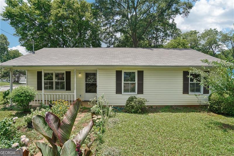 Charming and adorable ranch-style home in downtown Cartersville! This delightful property features a spacious front and back yard-perfect for relaxing or entertaining. Enjoy the convenience of in-town living with the cozy charm of a classic ranch home." New painted rooms, cleaned carpet, and beautiful garden.