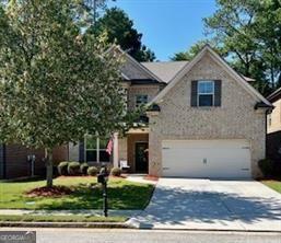 Welcome to this immaculate, fully furnished custom-built home in a quiet, family-friendly community. This spacious two-story residence offers 5 bedrooms and 3 full bathrooms, perfectly blending comfort and sophistication. The home features a dramatic two-story foyer, a bright office space, and a formal dining room with elegant trim and columns. The main floor includes a guest suite with a full bath, ideal for visitors or multigenerational living. The open family room includes a cozy fireplace and flows into the gourmet kitchen, which boasts granite countertops, stainless steel appliances, a center island, breakfast bar, and a sunny breakfast nook. Upstairs, enjoy a luxurious owner's suite with double vanities framed by graceful arches, garden tub, separate shower, private toilet room, and large walk-in closet. Two additional bedrooms are connected by a Jack-and-Jill bath with private vanities. Enjoy peaceful evenings in the beautifully landscaped and illuminated backyard oasis.