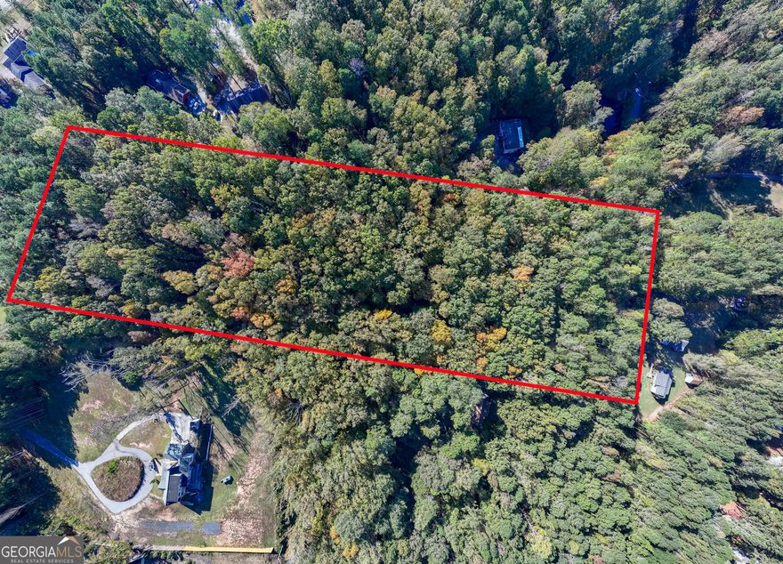 Prime opportunity in Lithonia, DeKalb County, Georgia! This 9.5-acre rectangular parcel at 7427 Asbury Drive (Lot 6) is zoned  R-100 and part of the SUB Land Use Plan - 8 Dwelling Units per Acre allowing minimum lot sizes of 15,000 square feet-ideal for subdivision or estate development. The property is high and dry with approximately 364 feet of paved road frontage, offering excellent access and visibility. Conveniently located just minutes from I-20, the site provides a smooth 20-25-minute commute to downtown Atlanta and is close to key amenities, including Emory Hillandale Hospital (5-10 minutes) and The Mall at Stonecrest (10 minutes) for abundant shopping, dining, and entertainment. Nearby routes such as Rock Chapel Road, Evans Mill Road, and GA-124 ensure strong regional connectivity. With established utilities in the surrounding area and proximity to schools, healthcare, and retail, this tract presents an outstanding residential development opportunity. Public utilities and Fiber-Optic Available.  Contact listing agent for interactive parcel map.