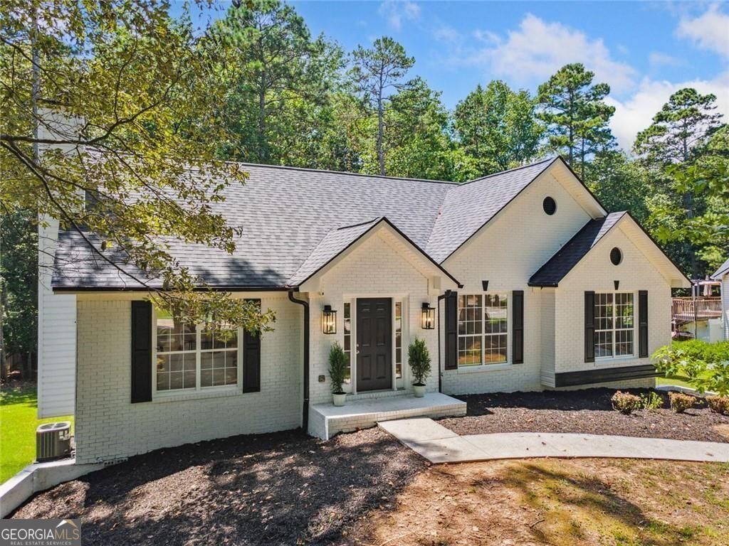 Welcome to 3840 Pilgrim Mill Rd - a completely REMODELED 5-bedroom, 3-bathroom home that's truly move-in ready. This beautifully updated single-level home features an open-concept kitchen, dining, and family room with recessed lighting and all-new fixtures throughout. Enjoy a brand new ROOF, new flooring, countertops, backsplash, stainless steel appliances, and fresh interior and exterior paint. The spacious primary suite is on the main level, with ensuite bathroom featuring a double vanity, soaking tub and tile shower. Downstairs, a newly finished basement offers a full in-law suite and a custom theater room, perfect for entertaining or multi-generational living. Situated on a large, flat private lot with fresh landscaping, new decking, and a cozy firepit area. Low HOA - Inclusive of Swim and Playground Area. Ideally located just off Exit 16 Pilgrim Mill - minutes from GA-400, Costco, Kroger, Shopping, LAKE LANIER, and lake access/boat ramp at Tidwell Park - this home combines modern updates with unbeatable location and convenience.