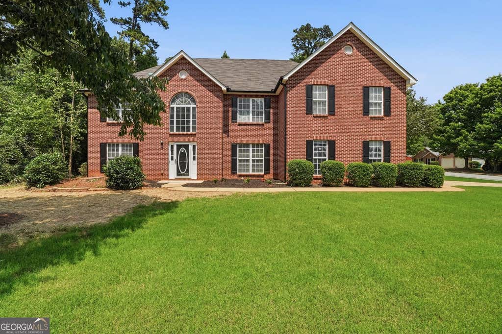 Photo of 5740 Grove Place Crossing, Lilburn, GA 30047 (MLS # 10784432)