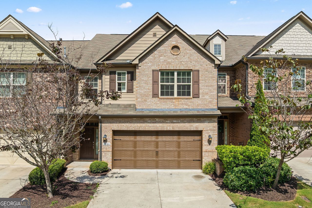 Priced well below market, this exceptional townhome at 9944 Cameron Parc Circle offers over 3,000 sq ft of beautifully finished living space and a rare third-floor bonus level-instead of a basement-complete with an extra bedroom, full bath, and versatile loft. On the main level, gleaming hardwood floors flow through an open-concept layout featuring a gourmet kitchen with granite countertops, stainless-steel appliances, a generous island, breakfast area, and convenient powder room. The adjacent family room, anchored by a gas fireplace, opens to a private yard. Upstairs, unwind in the luxurious primary suite, which boasts a cozy sitting area, dual walk-in closets, and dual vanities, a soaking tub, and a glass-enclosed shower. Two additional spacious bedrooms, a full bath, and the laundry room are all located on this level for effortless daily living. The third floor reveals a bright loft, an extra bedroom, and another full bath-ideal for a home office, media room, or guest suite. A two-car garage completes this highly convenient home. Located just minutes from top-rated State Bridge Crossing Elementary, Autrey Mill Middle, and Johns Creek High, you'll also enjoy nearby boutique shopping and fine dining. Don't miss this unbeatable combination of value, elegance, and location-schedule your private tour today