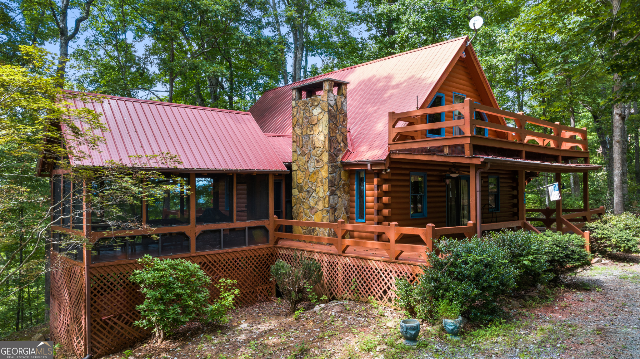 ALL OFFERS WILL BE CONSIDERED, SELLER IS MOTIVATED. A Blue Ridge Retreat with Unmatched Location, Views & Charm - Tucked less than five minutes from downtown Blue Ridge, this rustic 2-bedroom, 2-bath + loft, log cabin is the mountain getaway you've been dreaming of. Located in the highly desired Aska Adventure Area, this home is close by to countless hiking trails, stunning waterfalls, Lake Blue Ridge, Toccoa River, and plenty of delicious restaurants! Perched on 1.55 acres, it offers sweeping views of the mountains and the twinkling lights of downtown below - the best of both worlds: privacy and convenience. From the moment you step inside, the cabin's character shines. Original hardwood floors, vaulted ceilings, and a grand stone fireplace set the stage for cozy evenings by the fire. The open living space flows seamlessly to the outdoors, where a wraparound porch invites you to sip morning coffee while the sun rises over the mountains. Upstairs, the loft opens to its own private porch and a catwalk that leads to a rooftop deck - the perfect perch for stargazing or watching the sunset paint the sky. And when the cool mountain air sets in, the screened-in porch is made for grilling, laughter, and evenings that linger long past dinner. There's room here to dream, too. With space to build an ADU or garage, this property can easily expand with your vision - whether it's a guest cabin, a studio, or simply extra room for toys and tools. This home is great for full-time living, vacation/secondary, or an income producing short or long-term rental! Rustic yet refined, private yet close to town - this cabin offers a lifestyle you won't find anywhere else.