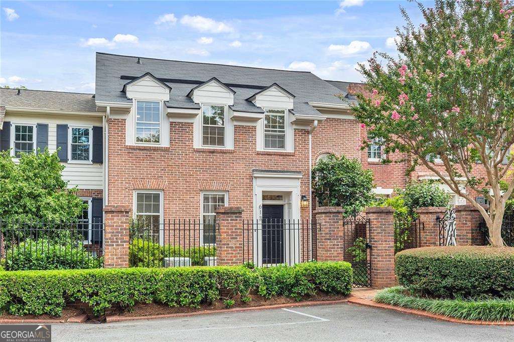 Quintessential Decatur Living in Coveted Hampton Court! Discover the perfect blend of exclusivity and convenience in this stunning 3-bedroom, 4-bathroom townhome in the highly sought-after Hampton Court community. Thoughtfully designed, this home features the largest 2-car garage in the complex, over 240 square feet of private outdoor balcony space with skyline views of Downtown Decatur, and a flexible floor plan that accommodates a variety of lifestyles.Ideally located across from Saint Thomas More School, and just two blocks from Adair Dog Park and The Toy Park, this home is also steps from Decatur's celebrated dining scene. Walk to James Beard Award-winning restaurants or local Hautes such as The Iberian Pig, Kimball House, Deer and Dove or everyone's favorite Taqueria Del Sol. Besides top-rated restaurants, this townhome is within the Award-Winning City of Decatur School District. Recent updates include refinished hardwood floors throughout, a new roof, upgraded recessed lighting, chef's kitchen with ceiling-height cabinetry and glass doors, showcasing the freshly paint on the interior and exterior. The den opens to a spacious, partially covered entertainment patio, complete with ceiling fans, mini fridge, and wiring for an outdoor TV. The patio is ideal for al fresco dining or unwinding under the sunset. Upstairs, a light-filled loft with built-in bookcases makes an ideal study or reading nook. The primary suite and guest bedroom, each with en-suite bathrooms, are located upstairs, while a third en-suite bedroom on the main level could serve as an additional primary suite or guest retreat. The fully finished basement includes a full bath, wet bar, and ample storage. The space is perfect for a gym, office, playroom, or secondary living area. The oversized garage features a rare pedestrian door between bays and a full wall of built-in cabinetry for storage. Choose between rear garage access via West Ponce de Leon or front-door entry with just one step into the kitchen which is ideal for unloading groceries with ease. With a beautifully landscaped setting, privacy and unmatched walkability, Hampton Court remains one of Decatur's most coveted addresses. Decatur is ranked the #1 place to move in Georgia and #5 in the U.S. by MoveBuddha. Decatur is in high demand with 2.4 people wanting to move in for every 1 person who leaves.