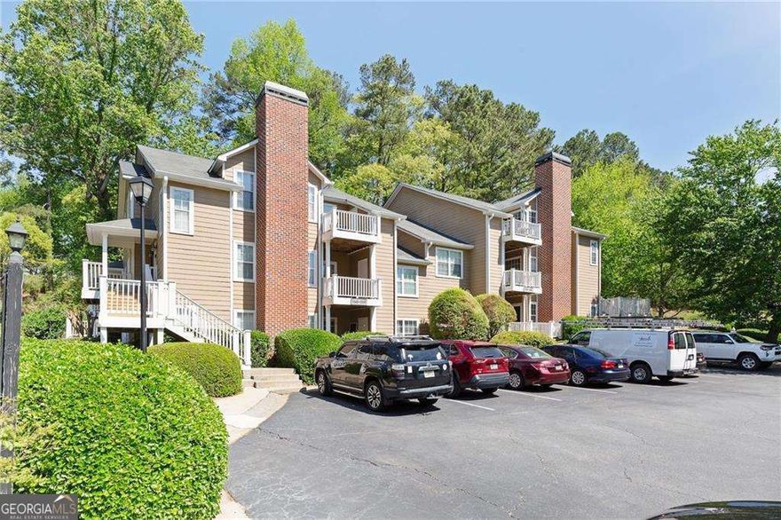 Tucked away in East CobbCOs desirable location, this 2-bedroom, 2-bath condo offers easy, everyday comfort in the sought-after Walton High School district. Surrounded by wooded views and just minutes from parks, shopping, dining, and top-rated schools, itCOs the perfect blend of convenience and serenity.  Inside, the open layout features a sun-filled family room with a cozy fireplace, a dining area, and a kitchen with plenty of cabinet space. The owner's suite includes a large walk-in closet and a private bath, while the secondary bedroom offers flexibility for guests, a home office, or quiet downtime. Step outside to a private, covered patio ideal for morning coffee or evening wind-downs. The community includes a pool and direct access to the Cochran Shoals loop and Sope Creek trails. HOA dues cover water, trash, exterior maintenance, pest control, landscaping, hazard insurance, and moreCoallowing you to focus on enjoying your surroundings. With a comfortable layout and an unbeatable East Cobb location, this condo presents a fantastic opportunity in one of the areaCOs most established communities.