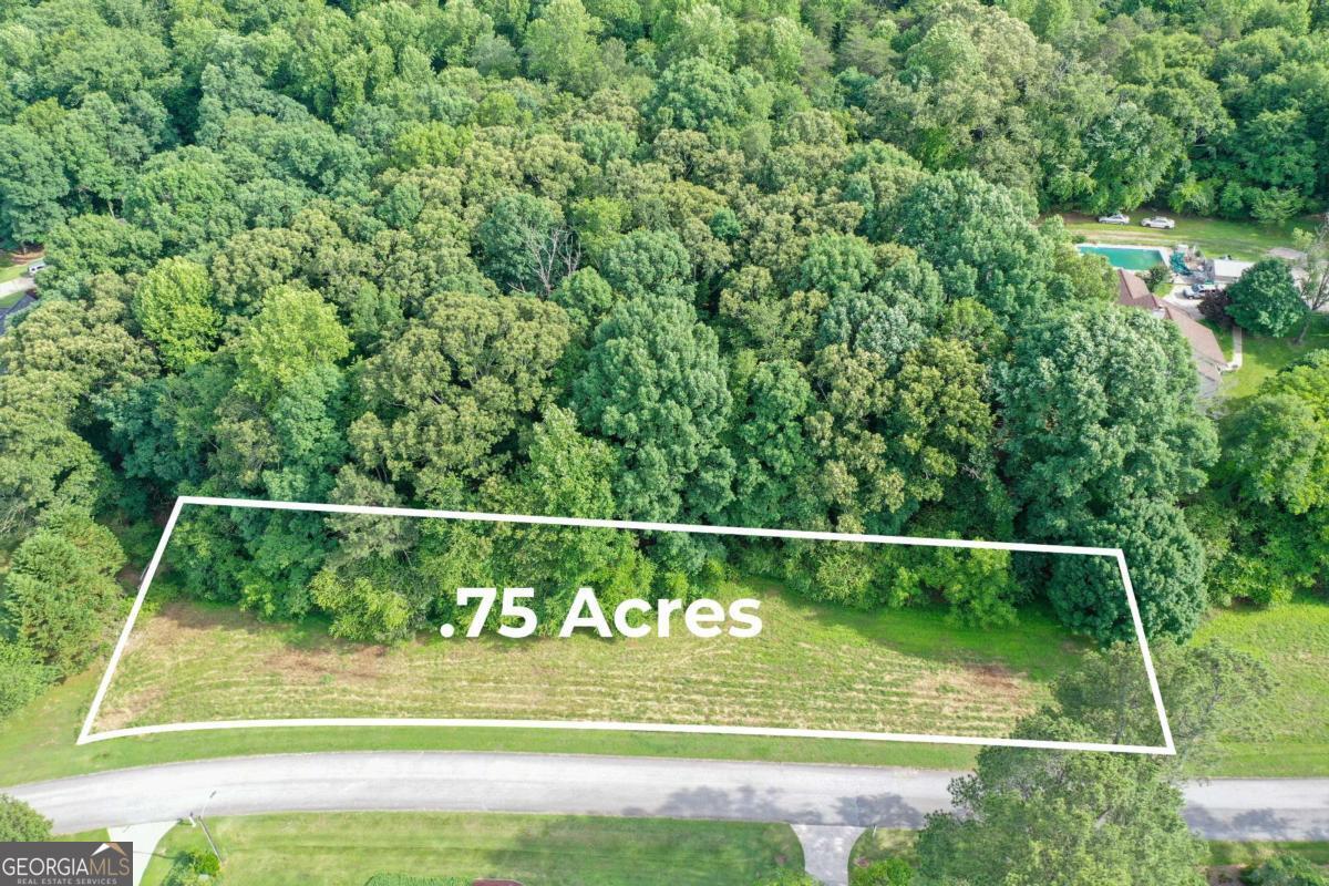 Welcome to a rare opportunity in the heart of North Hall-this vacant lot, tucked within the well-established and desirable Creekstone Subdivision, is a blank canvas full of promise. Surrounded by charming homes and mature landscapes, this homesite offers the perfect setting to build the home you've always dreamed of, tailored to your lifestyle and vision. Enjoy peaceful suburban living with all the benefits of nearby city conveniences. Located just minutes from vibrant downtown Gainesville, you'll have easy access to a variety of local dining spots, boutique shopping, essential retail, and cultural attractions. Commuters will appreciate the quick connections to GA 365 and I-985, while weekend adventurers will love being close to Cleveland, Dahlonega, and the scenic North Georgia mountains. Located in the highly regarded North Hall School District, this lot combines a peaceful neighborhood feel with the benefits of one of the area's most respected school districts. Whether you envision a custom-built retreat or a timeless home, this lot is ready to bring your plans to life. Utilities available. Bring your builder and your dreams-opportunities like this don't come around often!