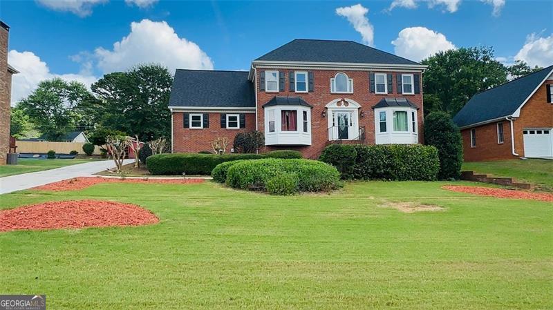 Welcome to this beautifully maintained and thoughtfully updated home located in the highly sought-after Brookwood School District. Featuring 5 bedrooms and 4 full bathrooms, this property offers the perfect blend of comfort, space, and functionality. Step inside to find gleaming hardwood floors on the main level and a renovated kitchen with modern finishes. The main level also includes a private in-law suite with its own kitchenette, ideal for guests or extended family. Enjoy entertaining or relaxing outdoors in the large, level backyard completed with a spacious deck, perfect for summer gatherings. Additional features include a full basement with endless potential. Located just minutes from shopping, dining, and everyday conveniences, this home has it all, space, updates, location, and top-rated schools. Don't miss your chance to make this incredible property your new home!