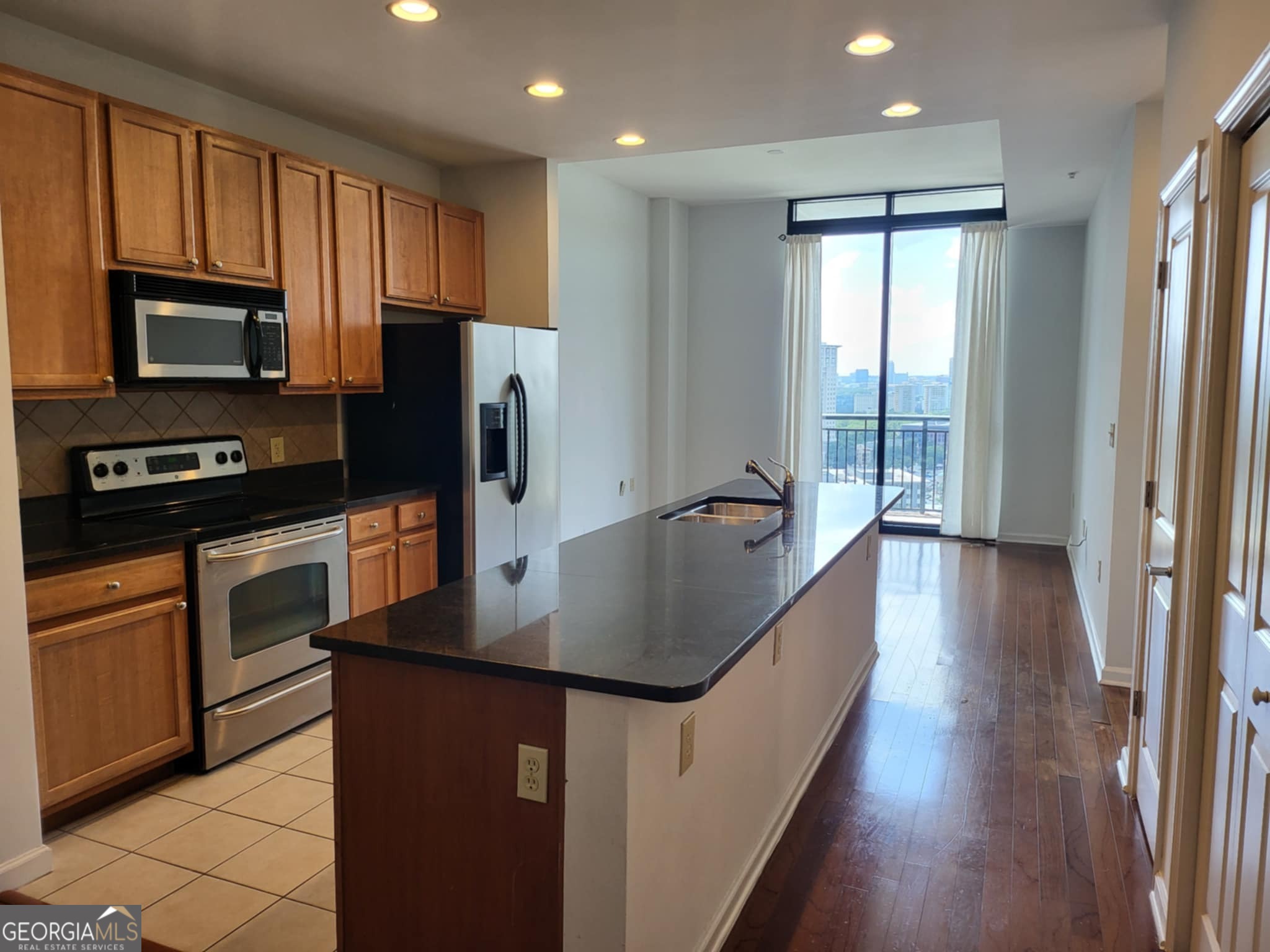 Just Listed! Gorgeous One-Bedroom Condo with City Views in the Heart of Buckhead. Experience luxury living in this stunning one-bedroom, one-bathroom condo located in the vibrant heart of Buckhead. This beautifully designed unit features floor-to-ceiling windows that flood the space with natural light and offer breathtaking views of the city skyline. Enjoy a spacious and open layout, including a large dining area and a generous living room that seamlessly connects to an oversized private balcony-perfect for morning coffee or evening relaxation. The modern kitchen boasts granite countertops, rich oak cabinetry, and stainless steel appliances, creating a stylish and functional space for cooking and entertaining. Additional highlights include an in-unit washer and dryer, ample storage, and elegant finishes throughout. Located in a premier building with easy access to shopping, dining, and entertainment, this condo offers the perfect blend of comfort, convenience, and sophistication. Don't miss your chance to own a piece of Buckhead luxury-schedule your showing today!
