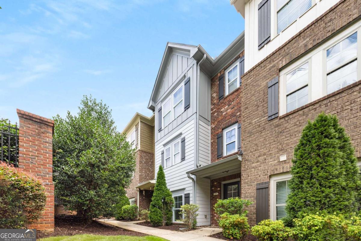 Welcome to this beautifully maintained 3-bedroom, 2.5-bath townhouse in the gated community of Kingston Point Manor, ideally located just minutes from downtown Decatur, Emory, and the CDC. This move-in-ready home offers the perfect combination of convenience, comfort, and low-maintenance living. Step inside to discover an inviting open-concept layout featuring hardwood floors, crown molding, and abundant natural light. The spacious living room flows seamlessly into the dining area and a modern kitchen equipped with granite countertops, stainless steel appliances, a breakfast bar, and ample cabinet space-perfect for entertaining or everyday living. Upstairs, you'll find a generous primary suite with a walk-in closet and an ensuite bath complete with dual vanities, a soaking tub, and a separate shower. Two additional bedrooms provide flexibility for guests, home office, or hobbies, and each has a private full bath. A convenient upstairs laundry room adds to the home's functional layout. Enjoy quiet mornings or evening relaxation on your private back deck, and take advantage of the attached garage for secure parking and storage. Kingston Point Manor offers beautifully landscaped grounds, a dog park, and easy access to I-285, shopping, restaurants, and parks.