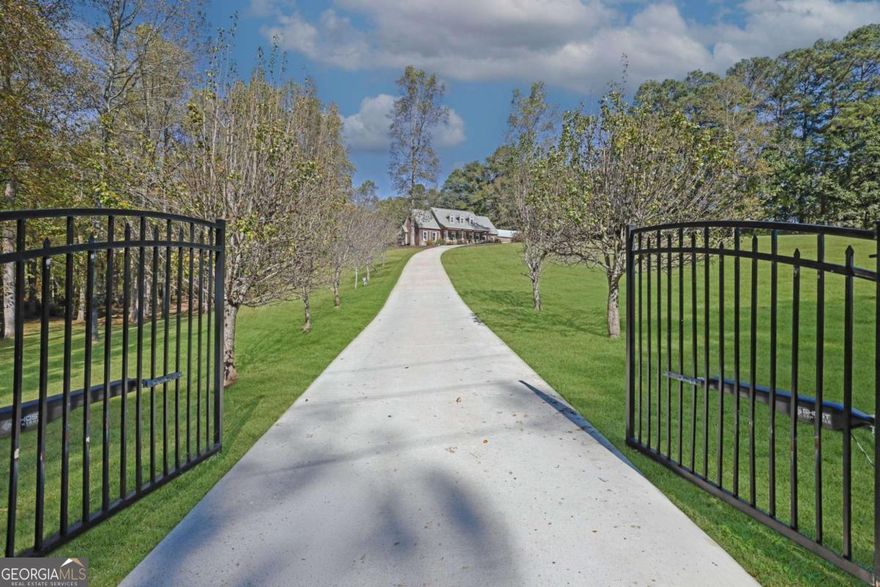 Live the Milton dream!  Expansive estate with classic all-brick ranch-style home surrounded by seven heavenly acres.  Verdant pastures, mature hardwoods, enchanting creeks combine with more than enough land to achieve your equestrian, homesteading and family compound visions.  The main level owner's suite has a sizable bedroom, his & her walk-in closets, oversized shower, custom cabinetry and double vanity. The kitchen has a breakfast nook, granite counters, stainless steel appliances, an oversized island, and two pantries. Upstairs you will find a huge game room, two bedrooms, a bathroom and colossal amounts of closet storage.  The north wing of the house has its own entrance, kitchen, dining area, living room with fireplace, two bedrooms, two baths and a sunroom forming the ultimate suite for in-laws, guests or adult children.  The large metal barn has two garage doors, its own kitchen, a loft, and workshop area.  Three car garage, house and barn are fully fenced in with room for a pool, etc.  With a storm shelter, raised beds for a victory garden, wood burning stoves for backup heat and a productive well for backup water you are prepared for anything life throws at you.  Too many features to list - must see - to appreciate this incredible opportunity.